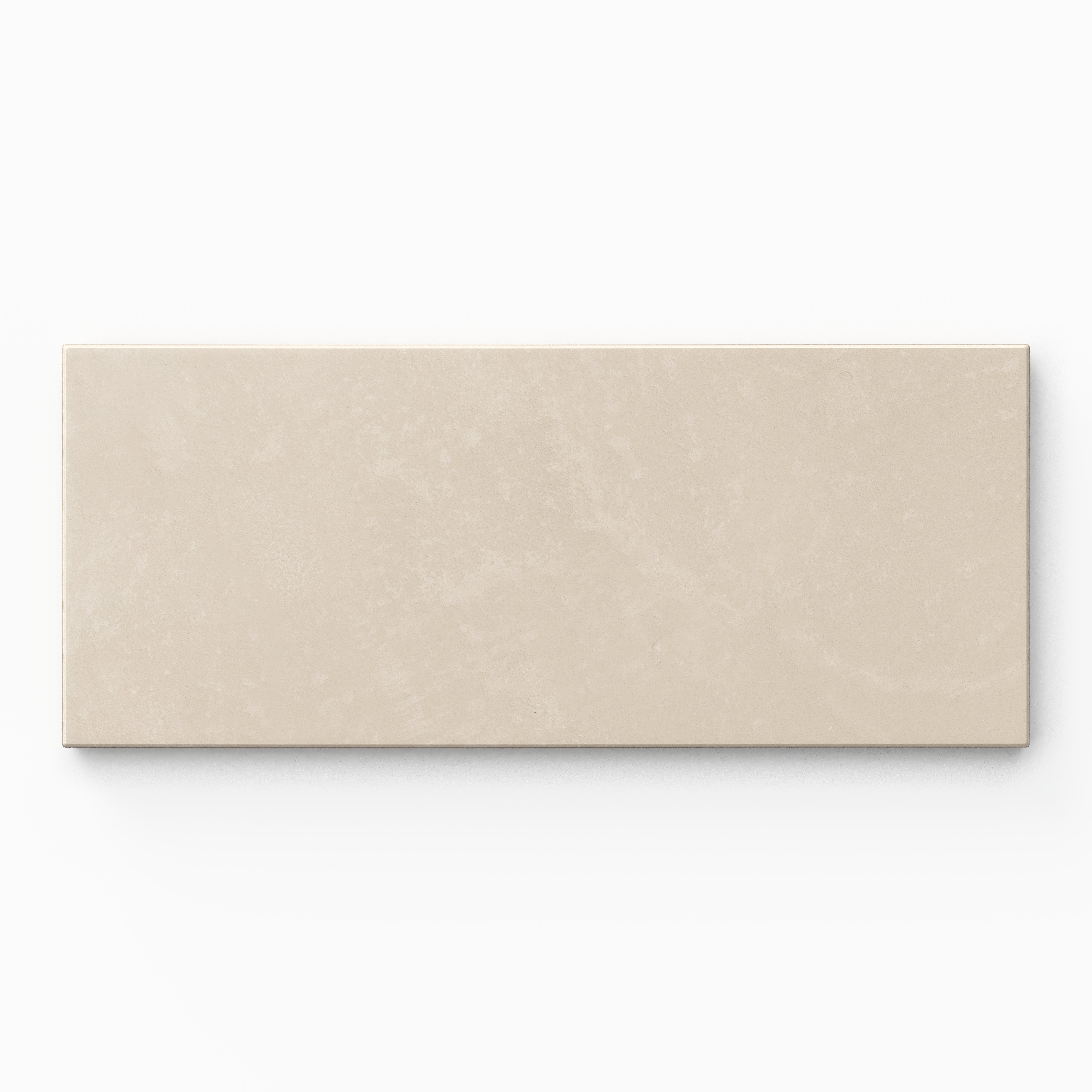 Isabel 2.5x12 Matte Porcelain Tile in Cream highlights earth-drawn grayish-beige hues, an elongated subway profile, and fine cement-plaster texture softened by a powdery matte glaze.