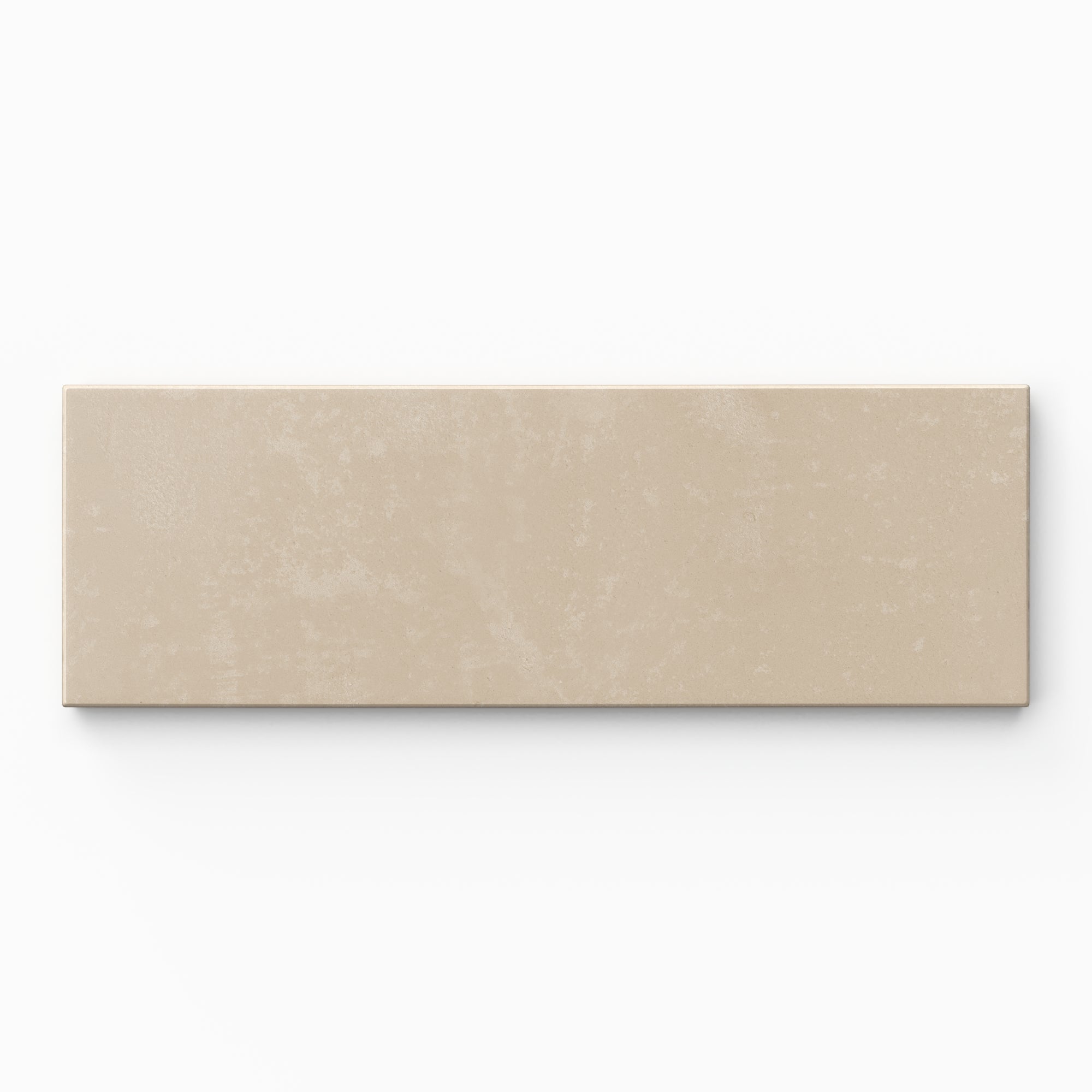 Isabel 2x6 Matte Porcelain Tile in Bone highlights a modern subway form with warm beige hues, understated cement-plaster texture, and a soft matte surface.