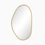 Asymmetrical mirror with an antique brass iron frame, bringing soft curves and earthy elegance to modern spaces.