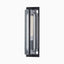 Contemporary wall sconce with curved clear glass tubing and a bold matte black brass frame.