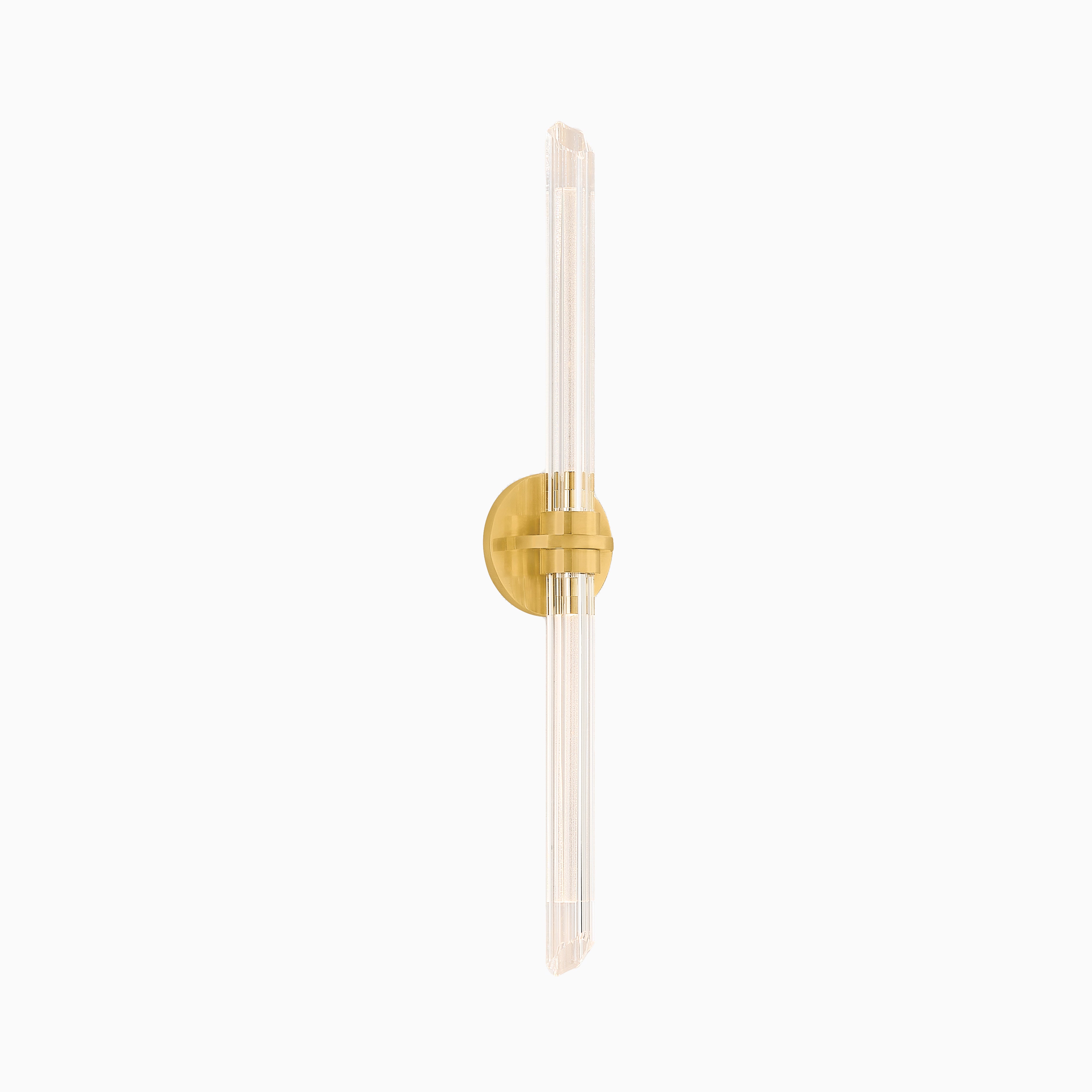 Slim vertical wall sconce with ribbed glass rods and a round gold base, designed for refined ambient lighting in modern interiors.