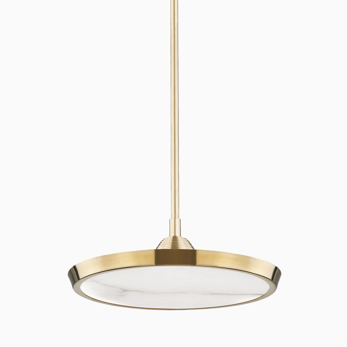 Compact round pendant light in aged brass finish with a flat circular shade, suspended by a slim rod for refined modern style.