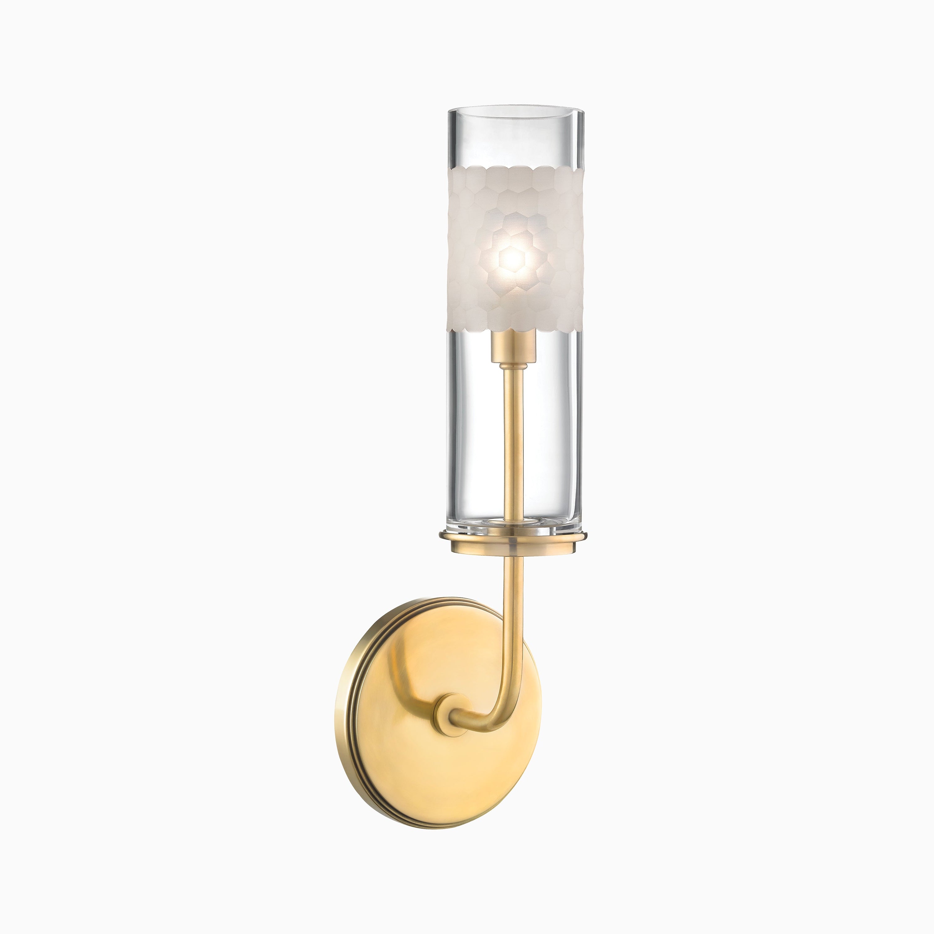 Elegant bath and vanity wall light in aged brass with a round backplate, clear glass cylinder, and frosted honeycomb accent shade.