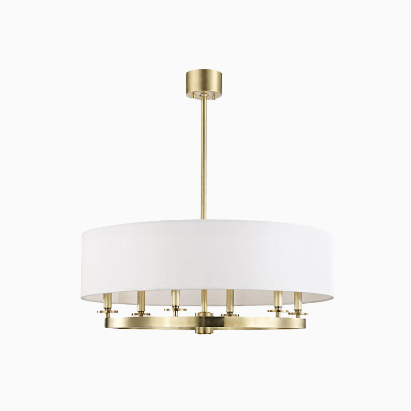 White chandelier with an off-white linen drum shade and golden aged brass ring base, offering soft, ambient light with elegance.