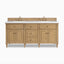 Eloide 72" double vanity in light natural oak with brass knobs, fluted detailing, and symmetrical cabinet-door design.