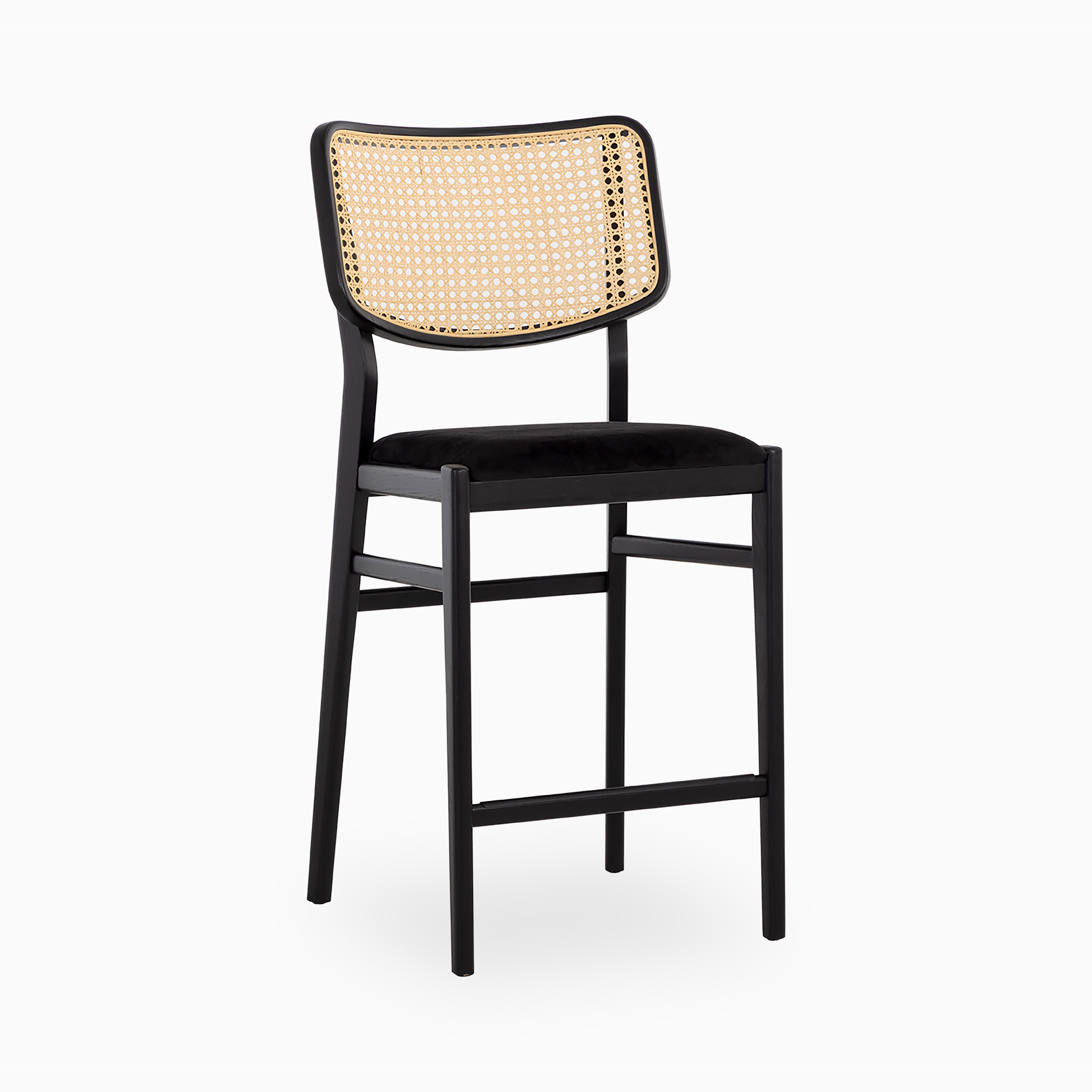 Mid-century counter stool with a beige cane backrest, plush black velvet seat, and sleek matte black wood frame.