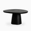 55" round outdoor dining table in black finish with solid sculptural base and smooth top, offering a bold modern minimalist design.