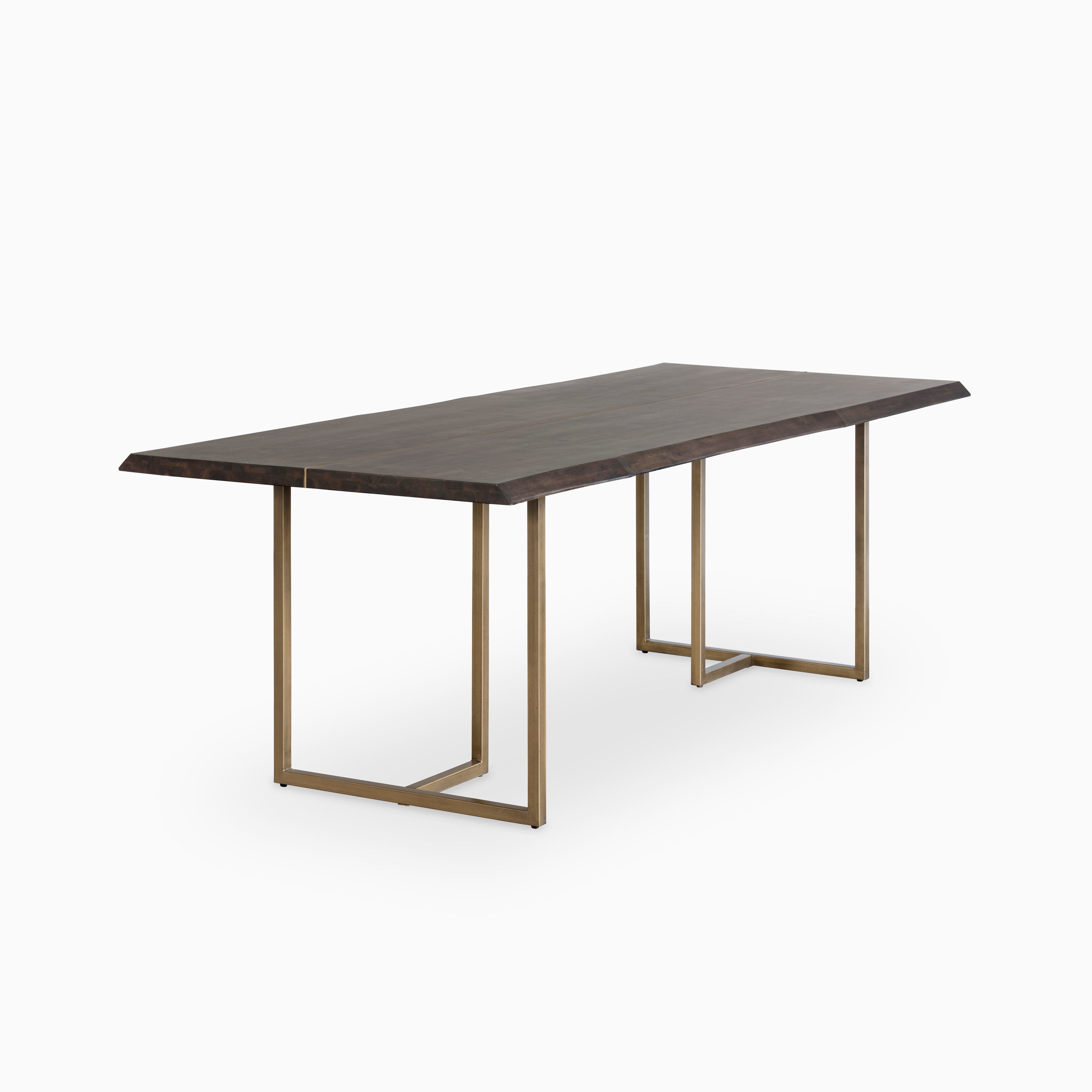 95" dining table with dark mango wood top and clean edges, paired with modern brass-finished metal legs for a sleek contemporary design.