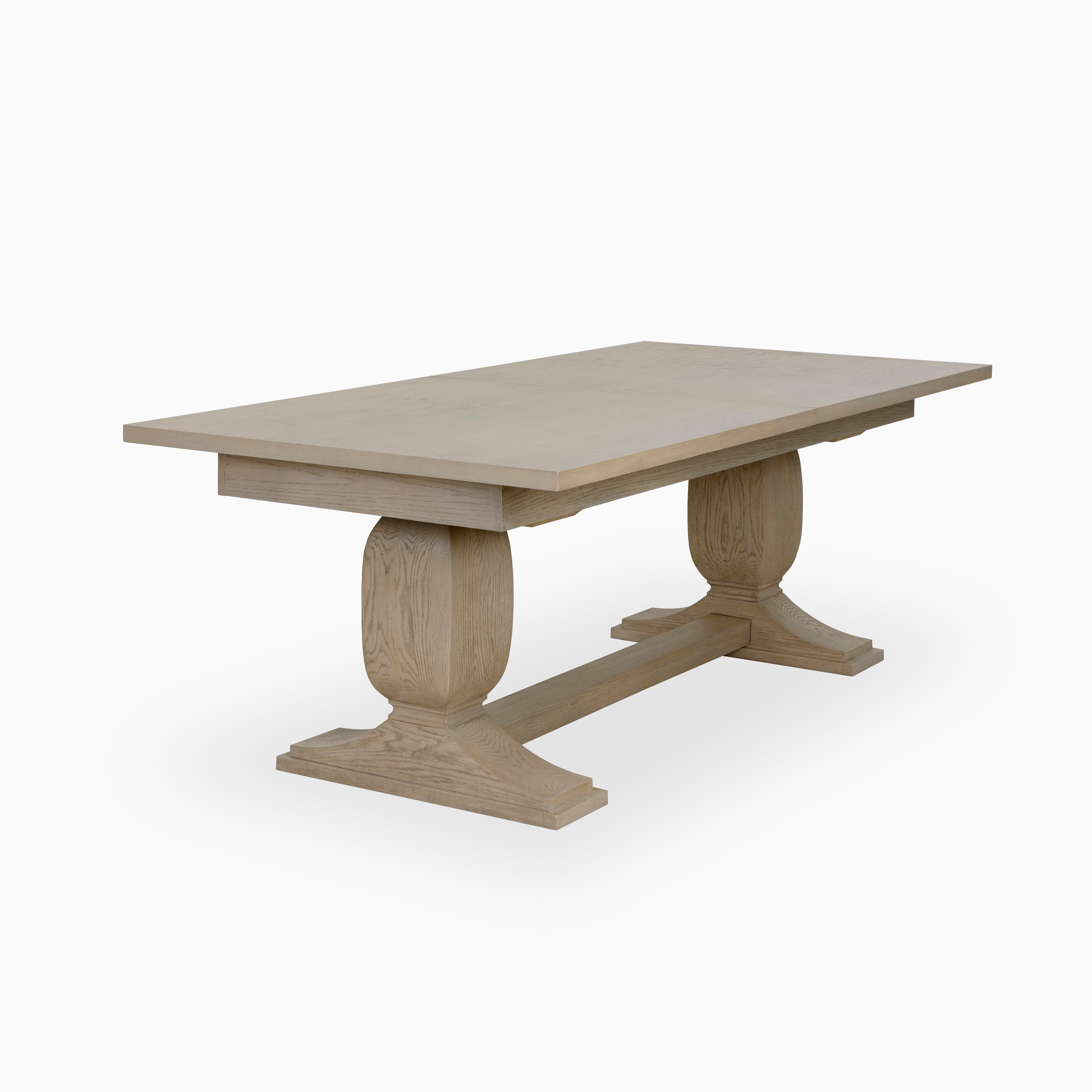 86"–120" extendable dining table in greige finish with solid wood construction, rectangular top, and double pedestal base design.
