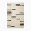 Minimalist hand woven rug made of wool, cotton and rayon with an off-white background and abstract black linear patterns, creating a modern, organic aesthetic.
