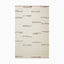 Minimalist hand woven rug made of wool, cotton and rayon with an off-white background and scattered, irregular brown linear accents for a modern, organic feel.