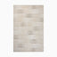 Power loomed area rug from Egypt made of polypropylene with a subtle linear pattern in soft beige and cream tones.