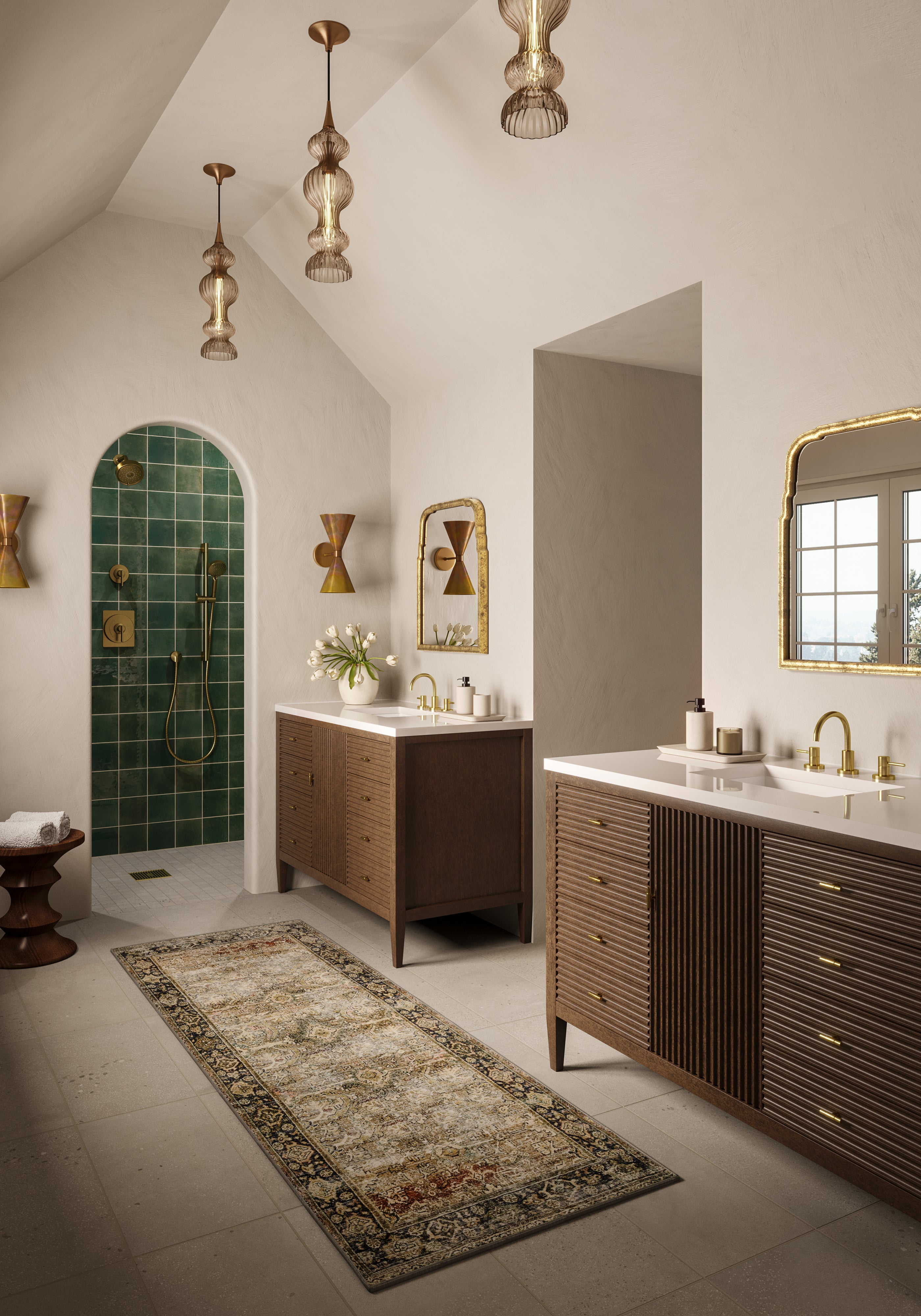 Bathroom with a dark green tiled shower featuring a rustic finish, paired with a wood vanity, brass accents, and neutral walls.