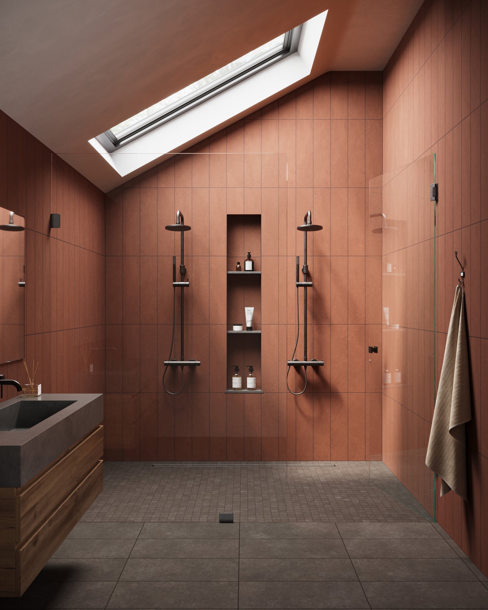 Contemporary bathroom featuring Wyatt Espresso 12x24 matte porcelain tiles on the floor, complemented by warm terracotta wall tiles and modern black fixtures, under a skylight.