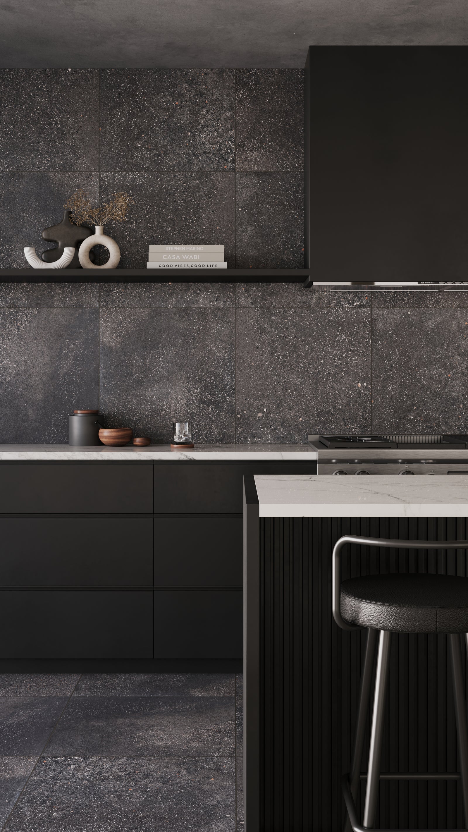 Sophisticated kitchen featuring Sloane 24x24 matte tiles in Charcoal, highlighting a speckled texture that adds depth and character to the modern black cabinetry.
