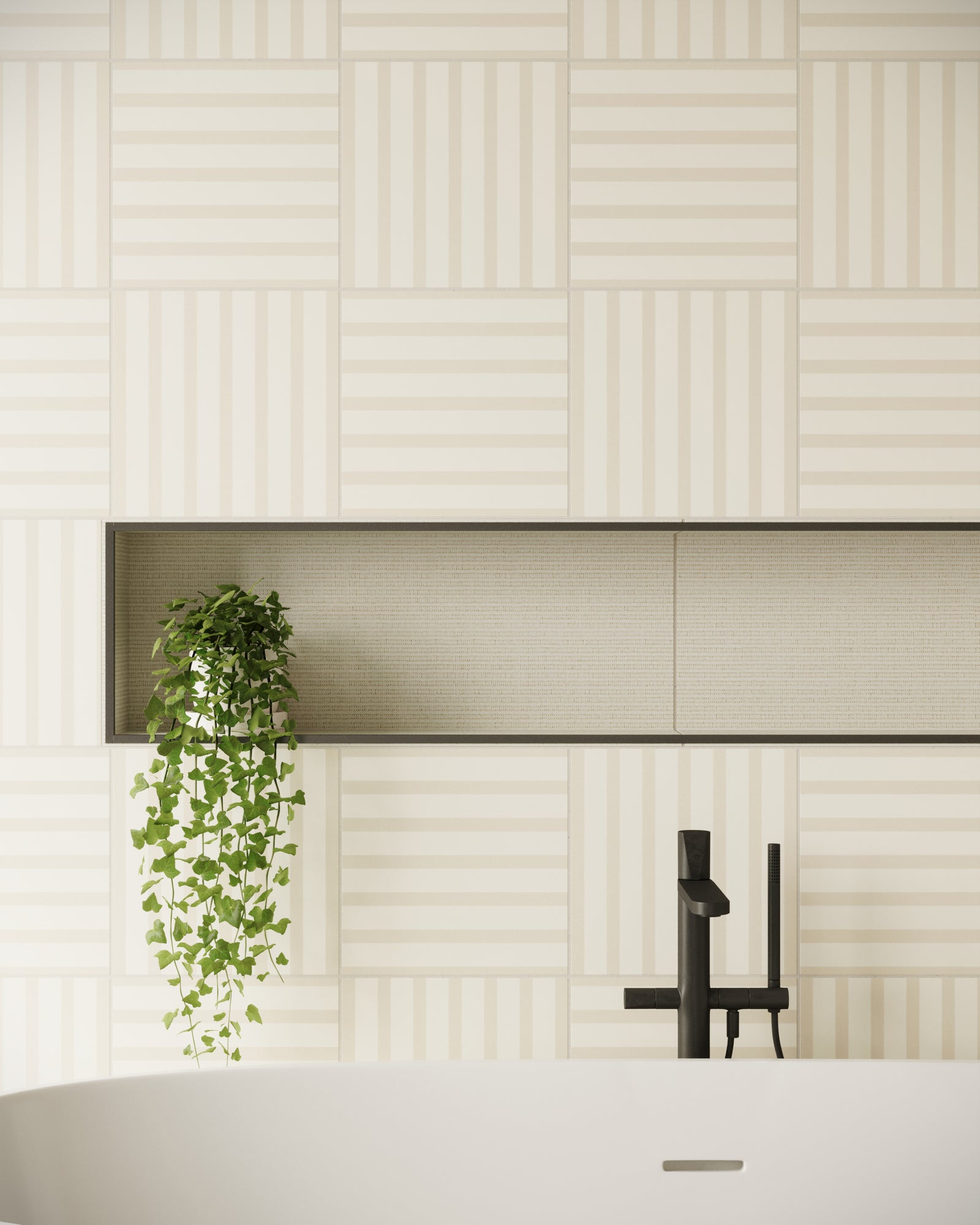 A serene bathroom wall featuring beige tiles with alternating horizontal and vertical striped patterns, complemented by a recessed shelf lined with textured tiles and cascading greenery.