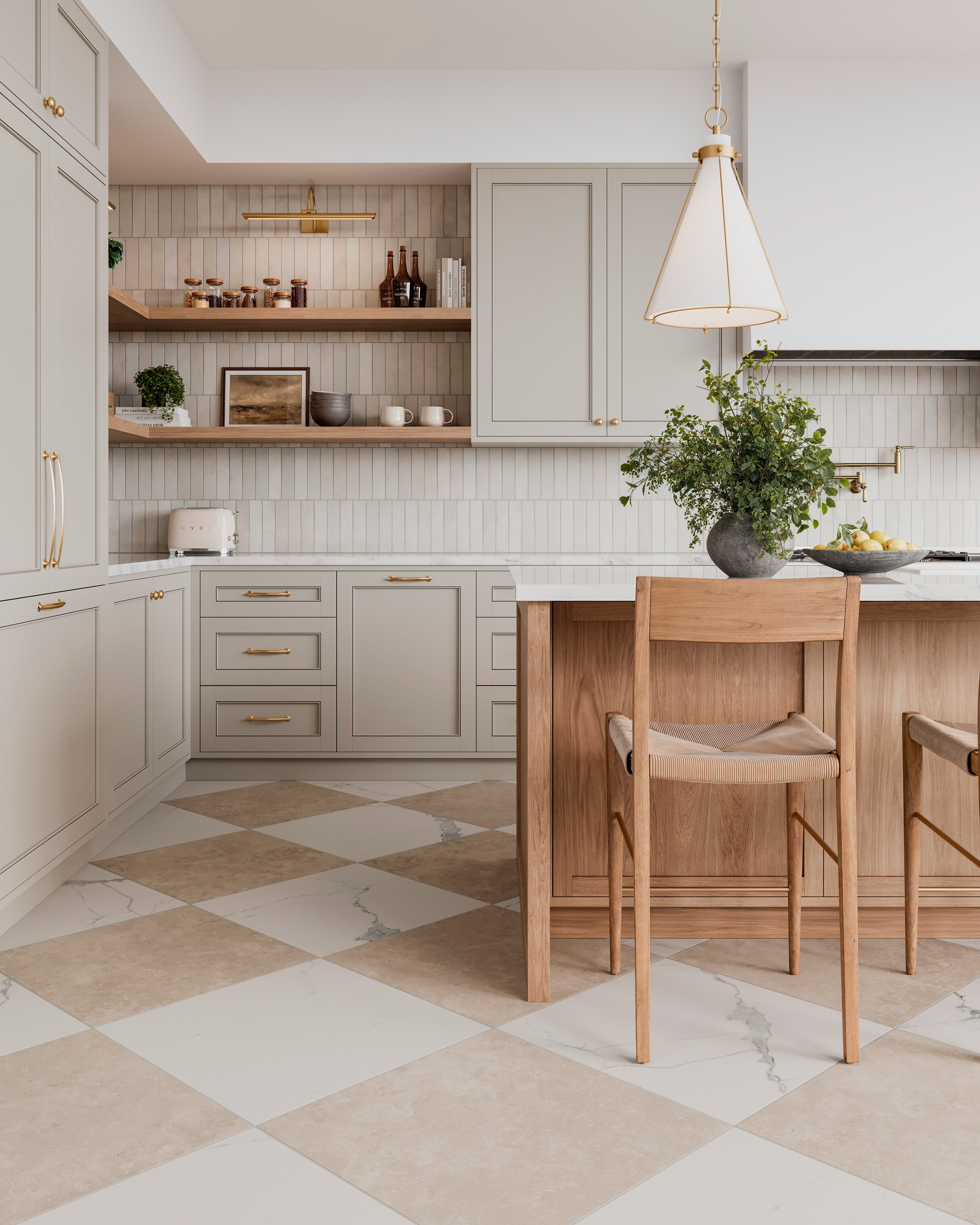 Kitchen with woven back bar stools at a wood island, paired with neutral cabinetry, brass accents, and beige and white checkerboard tile flooring.