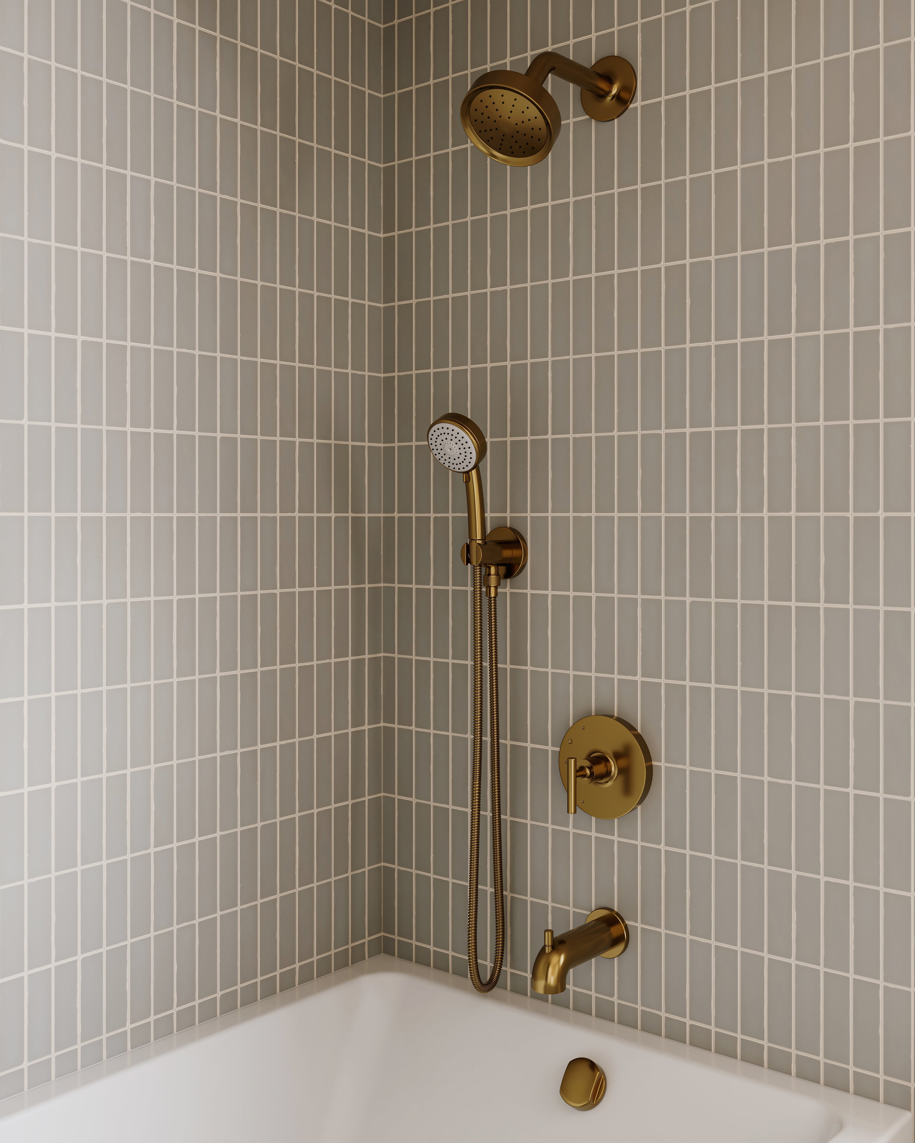Modern shower with matte brass fixtures and soft sage green subway tile, creating a sleek, spa-like ambiance.