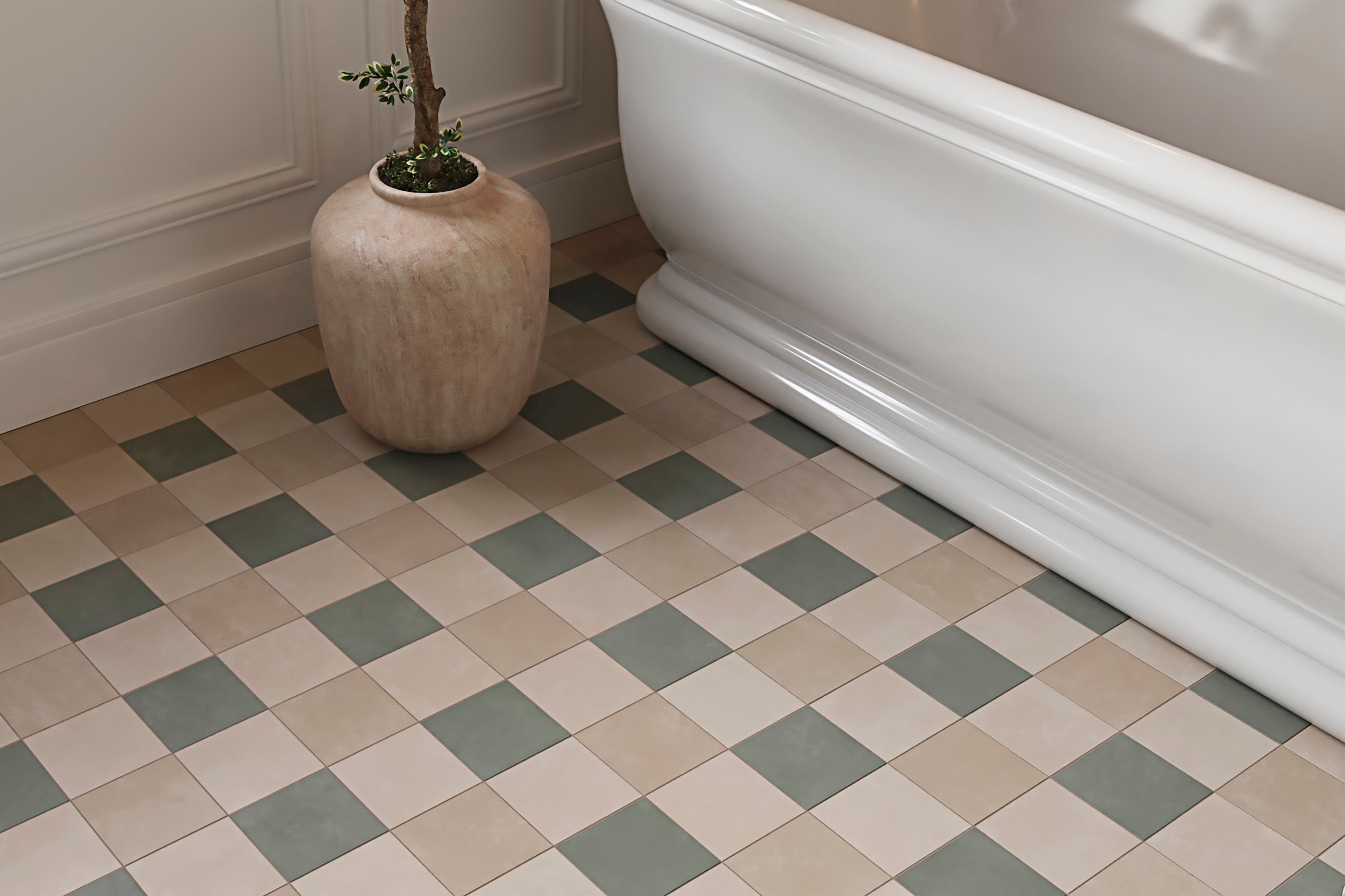 A checkerboard layout of 6x6 porcelain tiles in muted green and warm beige grounds the bathroom floor, pairing naturally with the freestanding tub and soft wall tones.