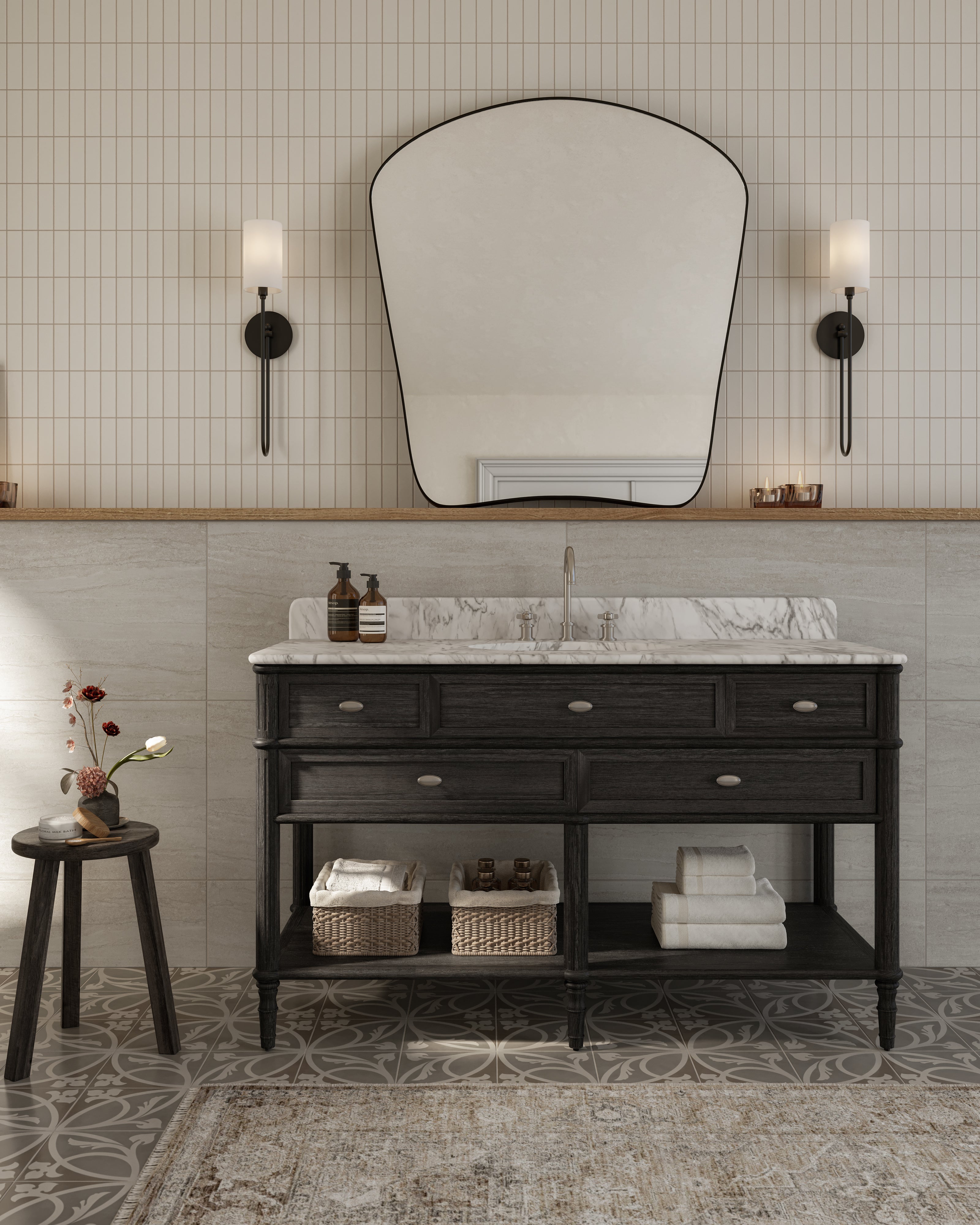 Bathroom with dark wood vanity and marble sink, wicker baskets, wall mirror, sconces, Brielle 8x8 patterned floor tiles, and rustic rug.