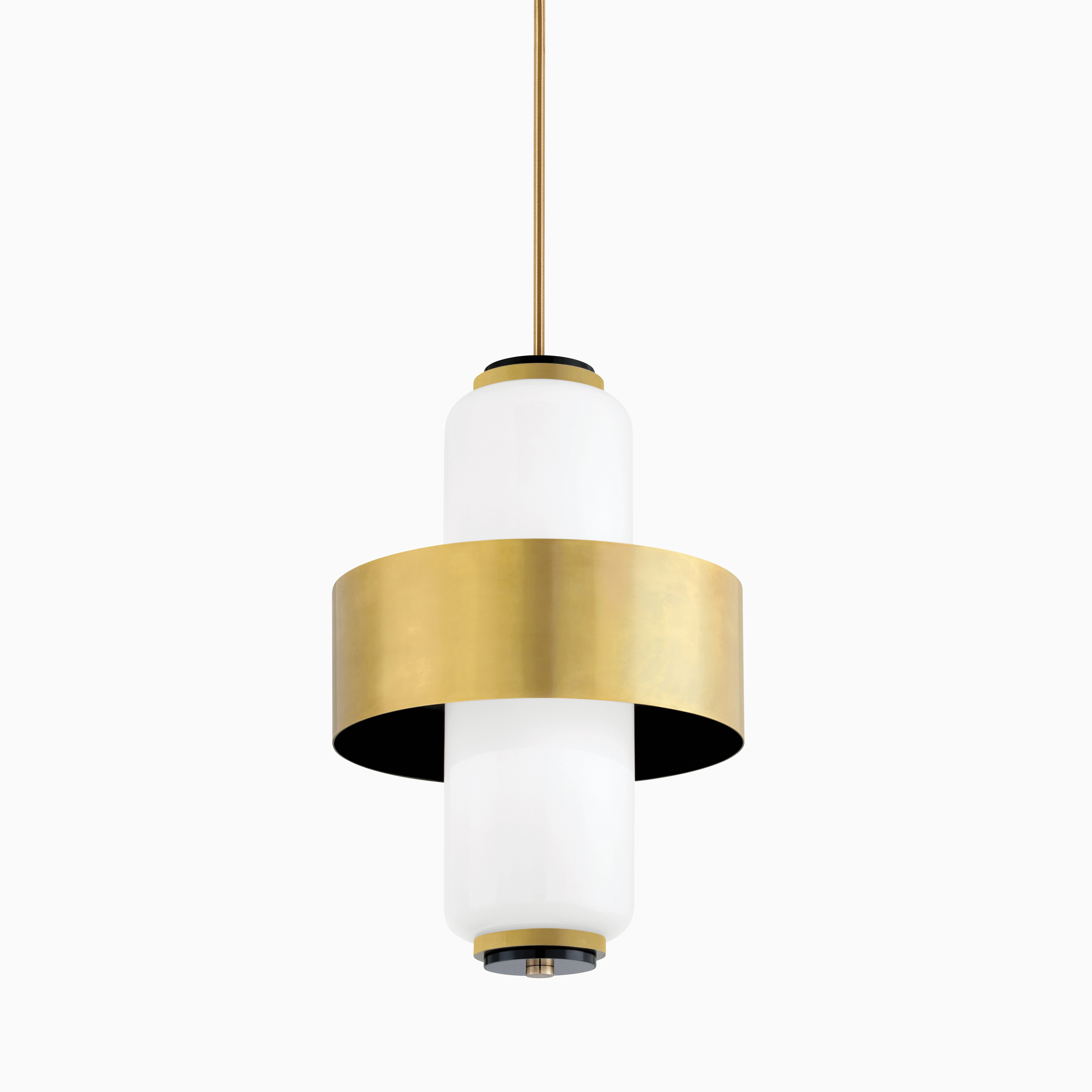 Pendant light with opal glass cylinder and wide brass band, blending modern elegance with striking vertical symmetry.