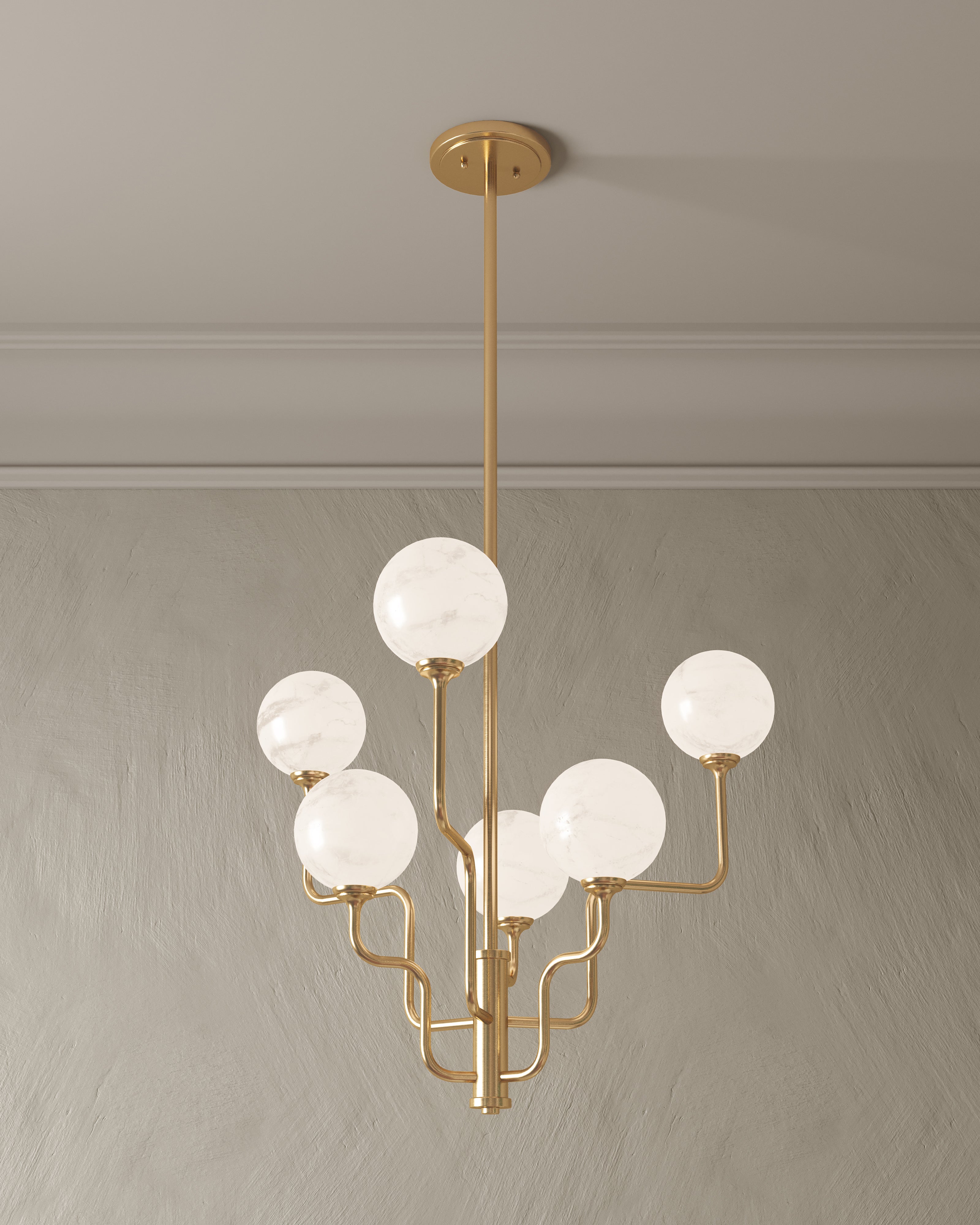 Elegant gold chandelier with curving arms and six glowing opal glass globes, creating a soft, organic lighting statement.