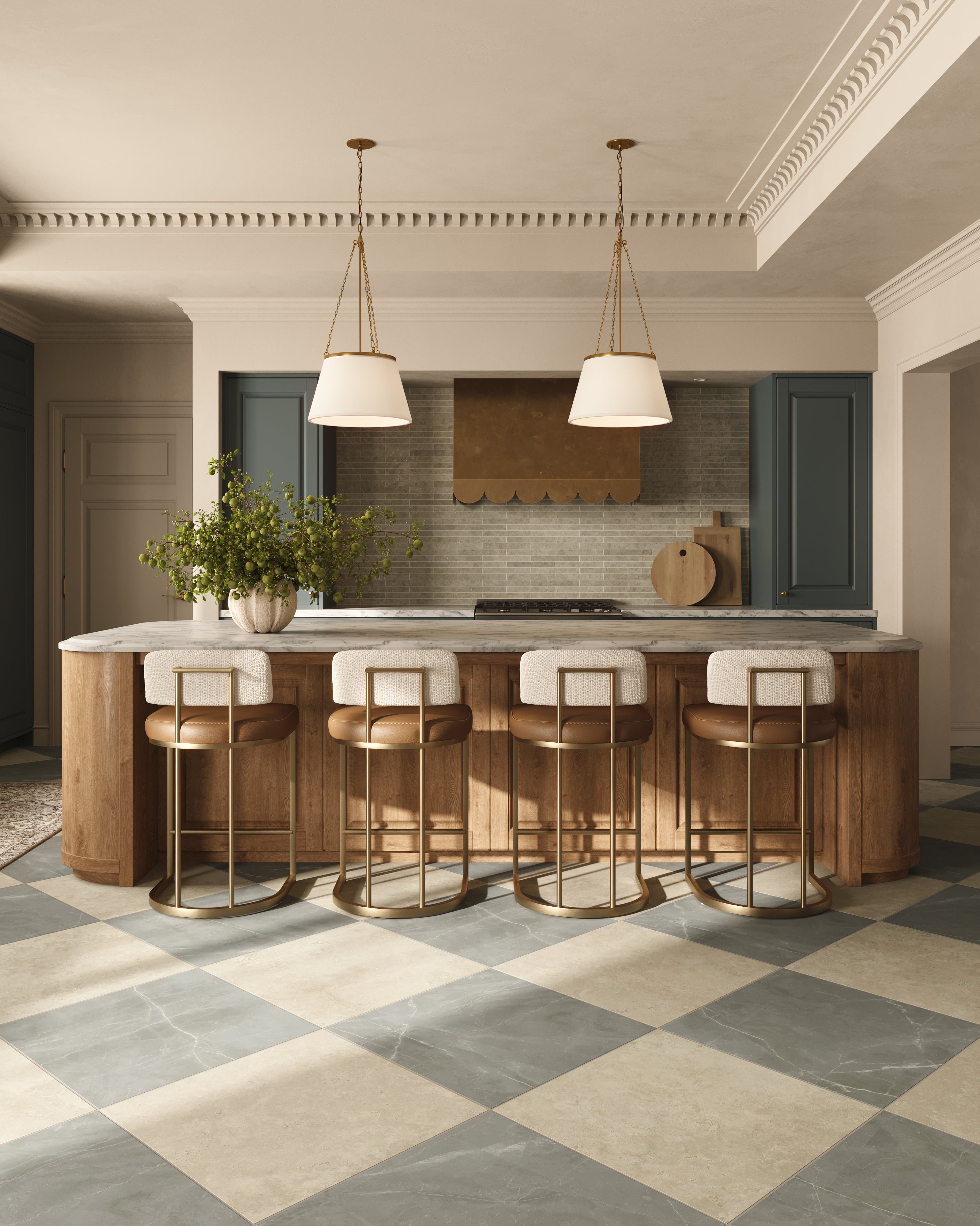 Classic-meets-modern kitchen with a large wood island, brass-accented bar stools, pendant lighting, deep green cabinetry, and a neutral checkerboard tile floor.