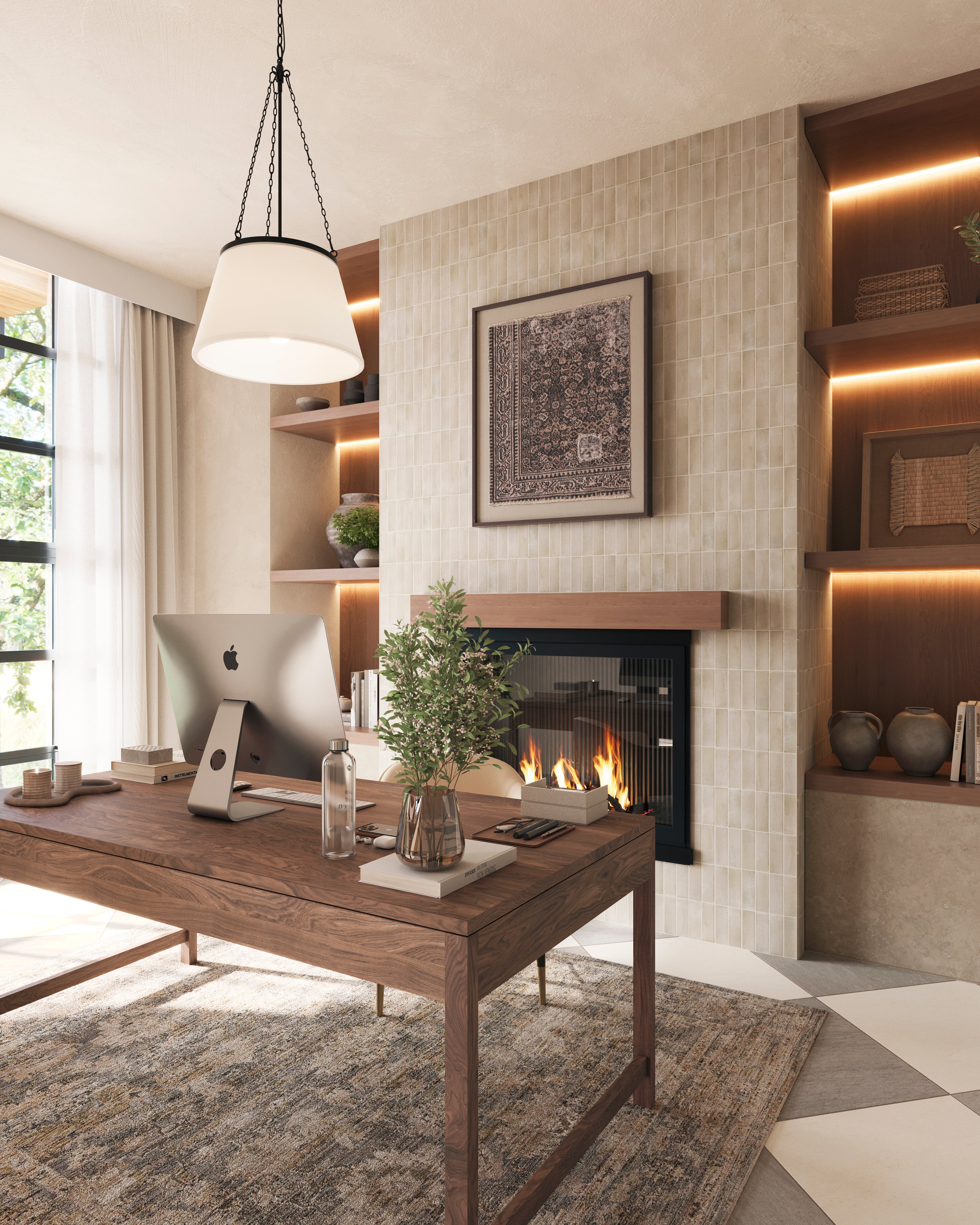 Matte black chain hung pendant light with a white fabric shade illuminating a workspace with a wooden desk, fireplace, and built in shelves with warm lighting.
