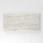 Light gray travertine-look porcelain 6x12 cove base tile with delicate linear veining, subtle texture, and a clean stone appearance.