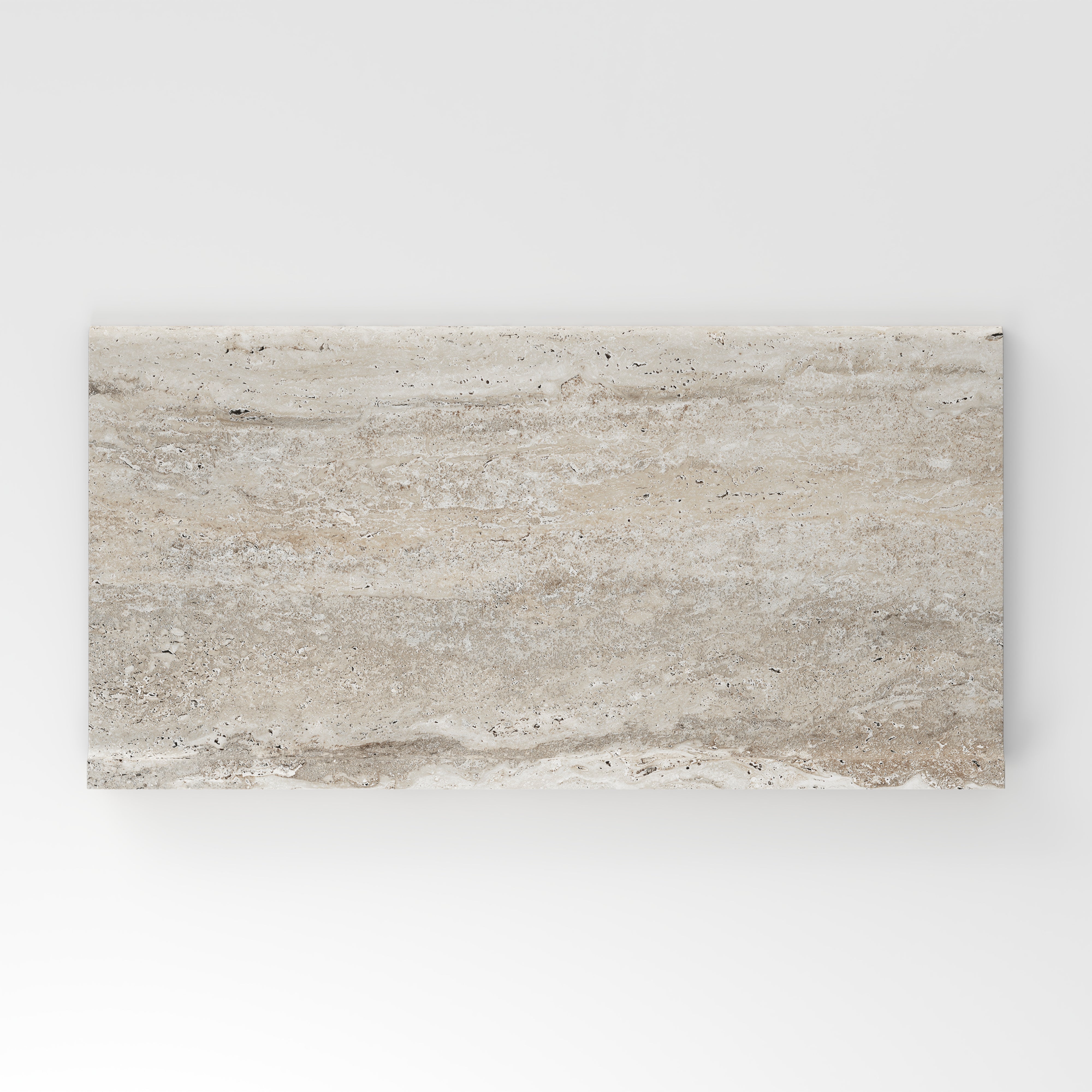 Cream travertine-look porcelain 6x12 cove base tile with soft linear veining, subtle movement, and a refined stone-inspired surface.