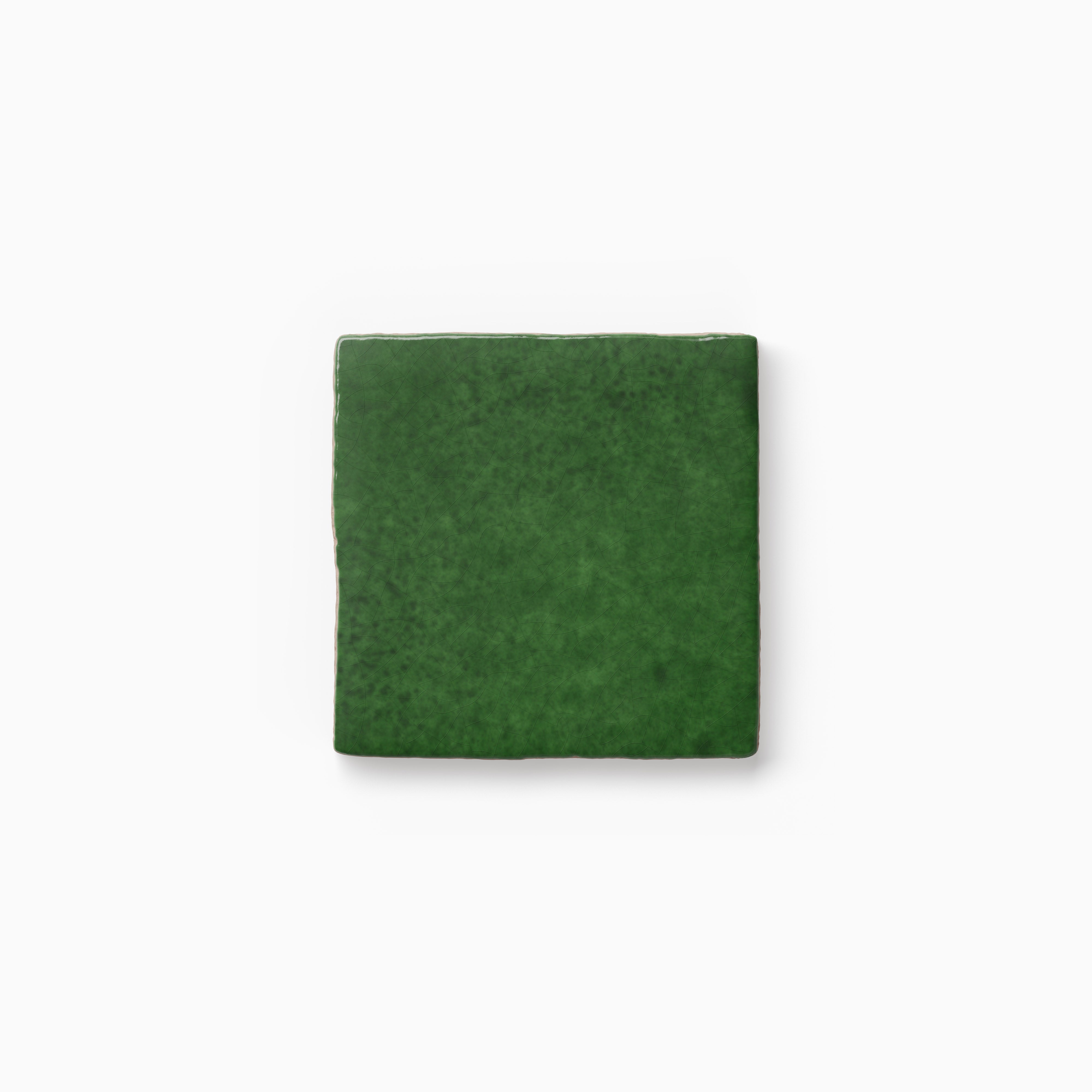 Square green tile sample featuring a handcrafted appearance, layered color variation, and a gently textured surface on a neutral backdrop.