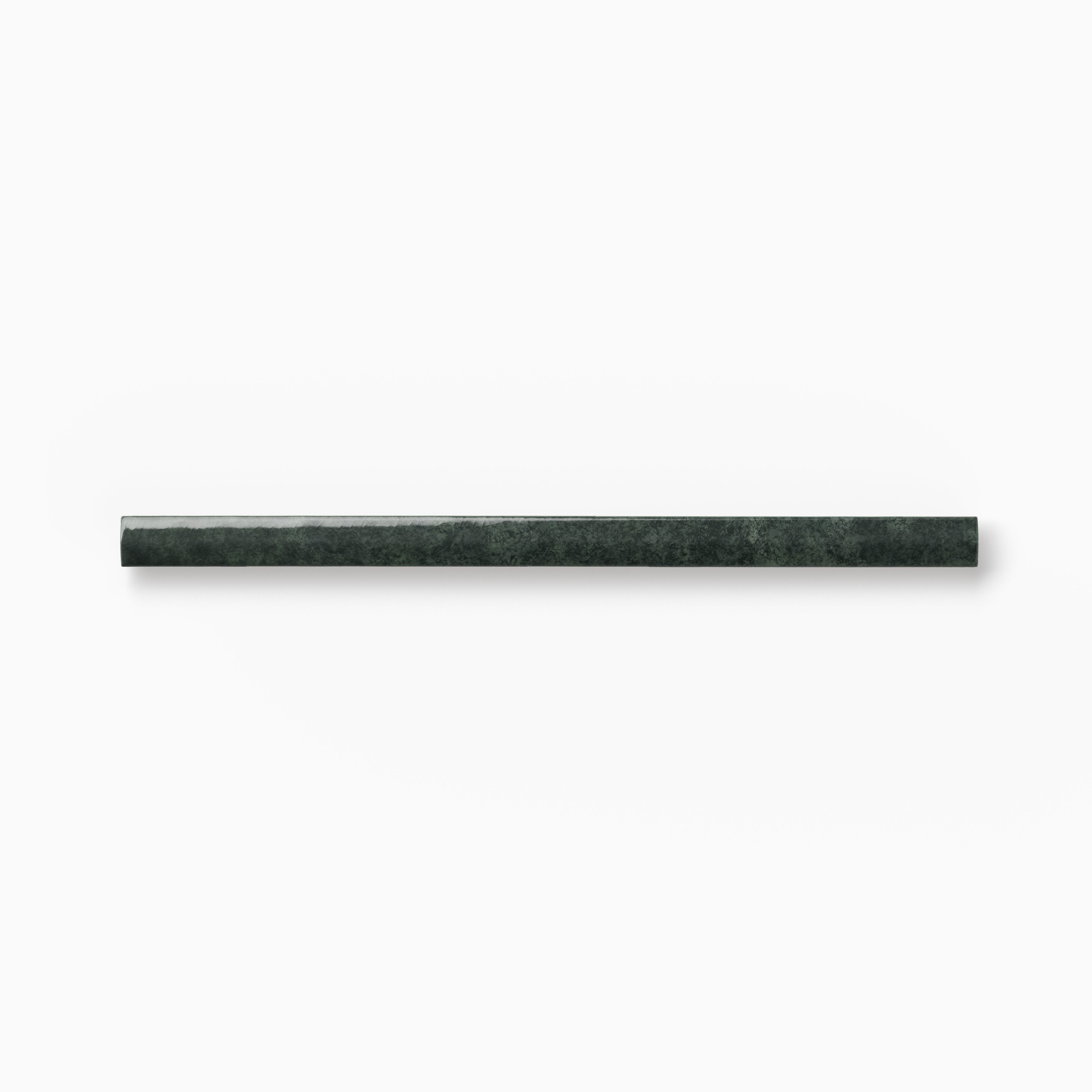 Slim dark green ceramic rounded edge trim with rich organic shading, soft surface movement, and a gently curved profile on a white background.