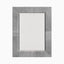 Rectangular mirror wrapped in gray hair-on cowhide featuring soft tonal variation and white leather whip-stitch accents with saddlework detail.