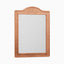Rectangular mirror with an arched top, framed in handwoven brown raffia that adds warm texture and natural character.