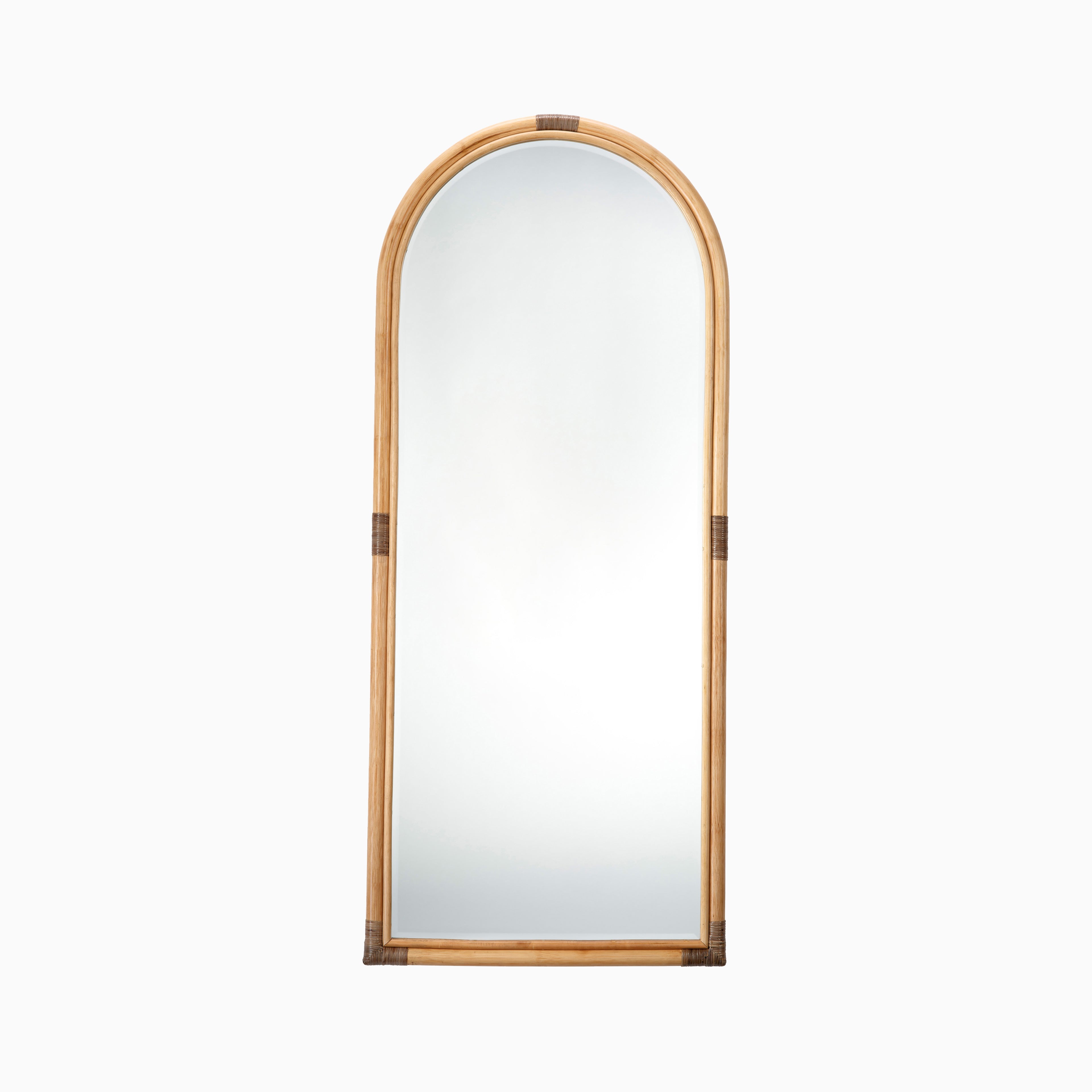 Arched full-length mirror with a natural rattan frame and subtle wrapped detailing for a relaxed, coastal-inspired look.