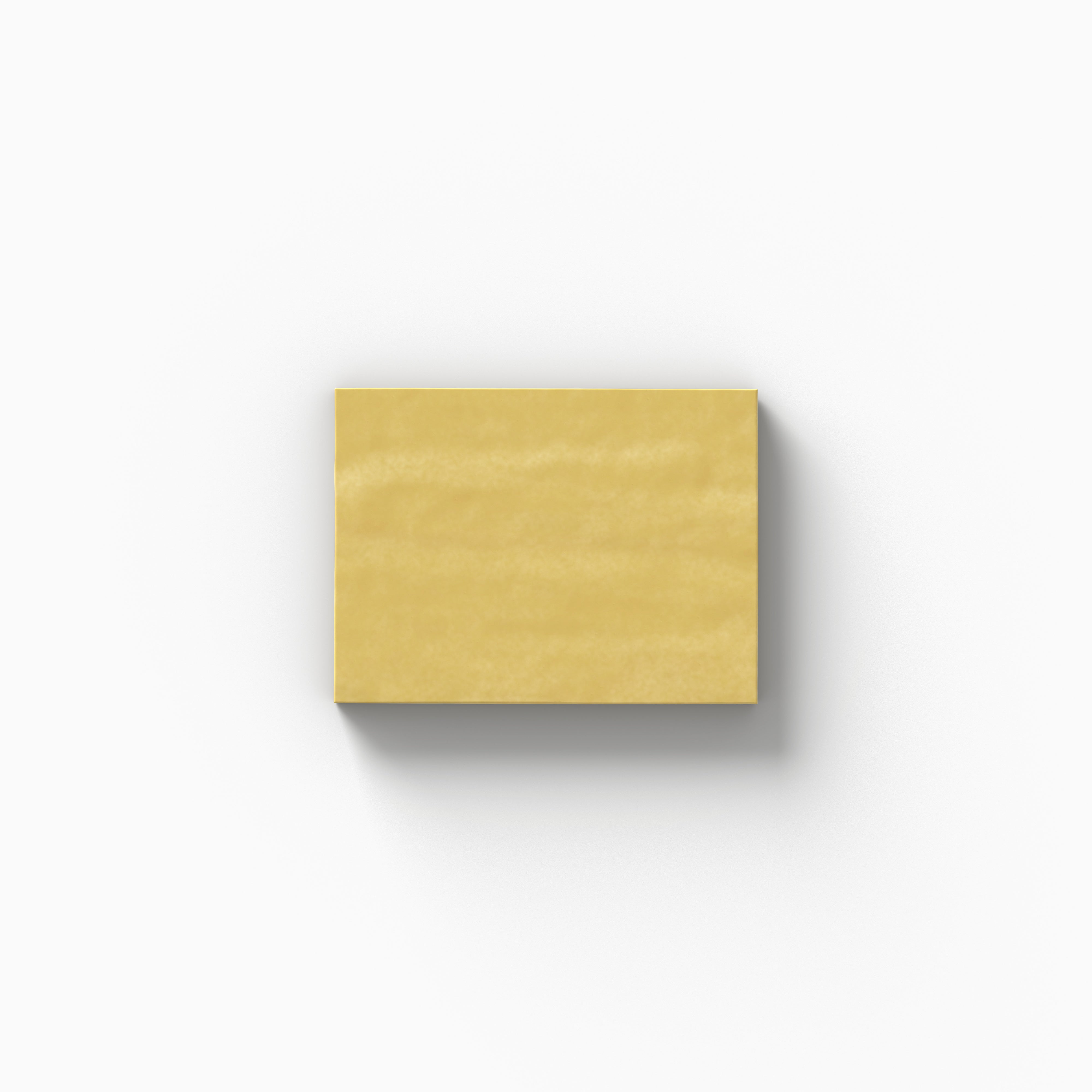 A golden-yellow 3x4 porcelain tile sample with a glossy finish, showcasing gentle color movement and handcrafted character on a white backdrop.