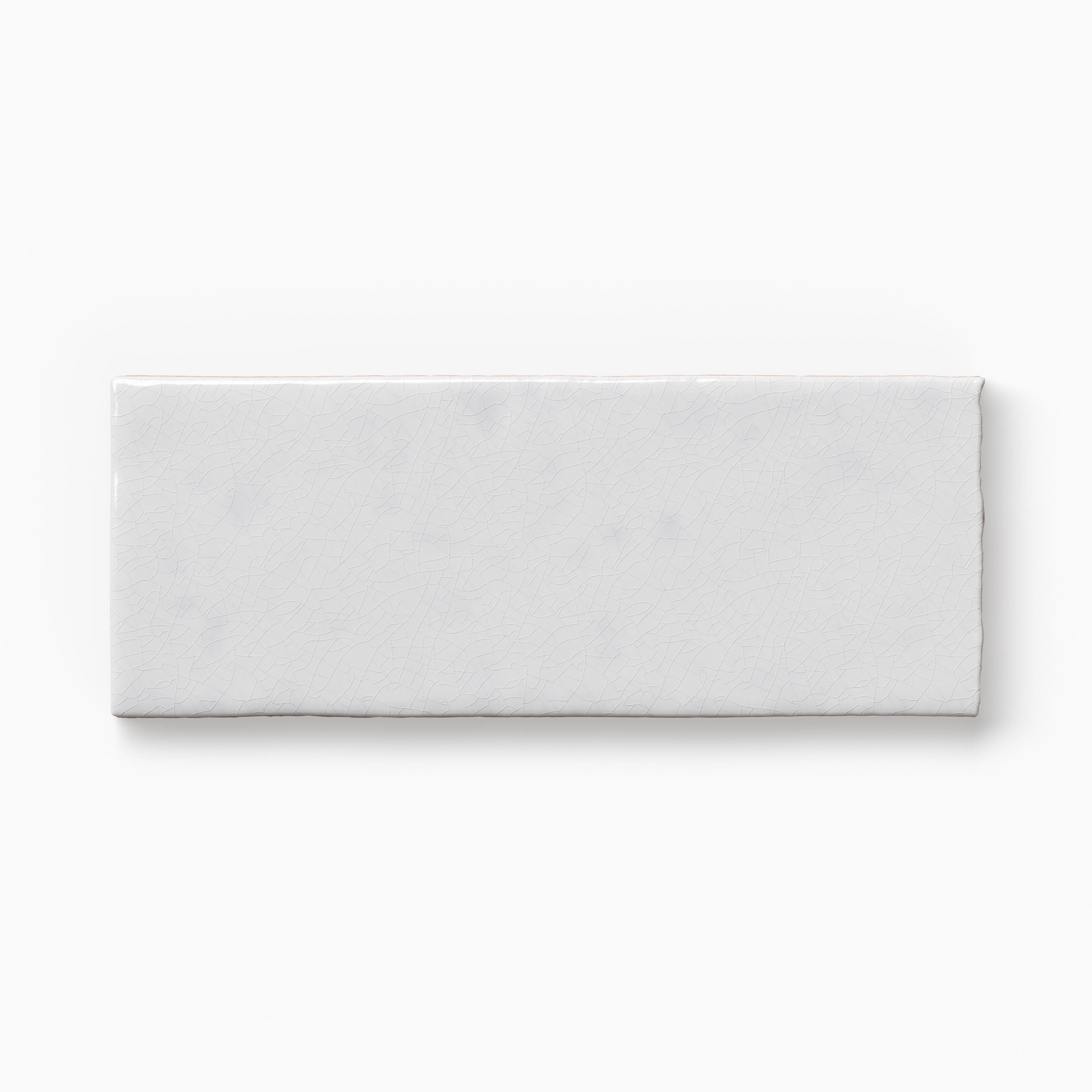 Rectangular white tile sample with a matte surface, subtle texture, and softly irregular edges displayed against a white background.