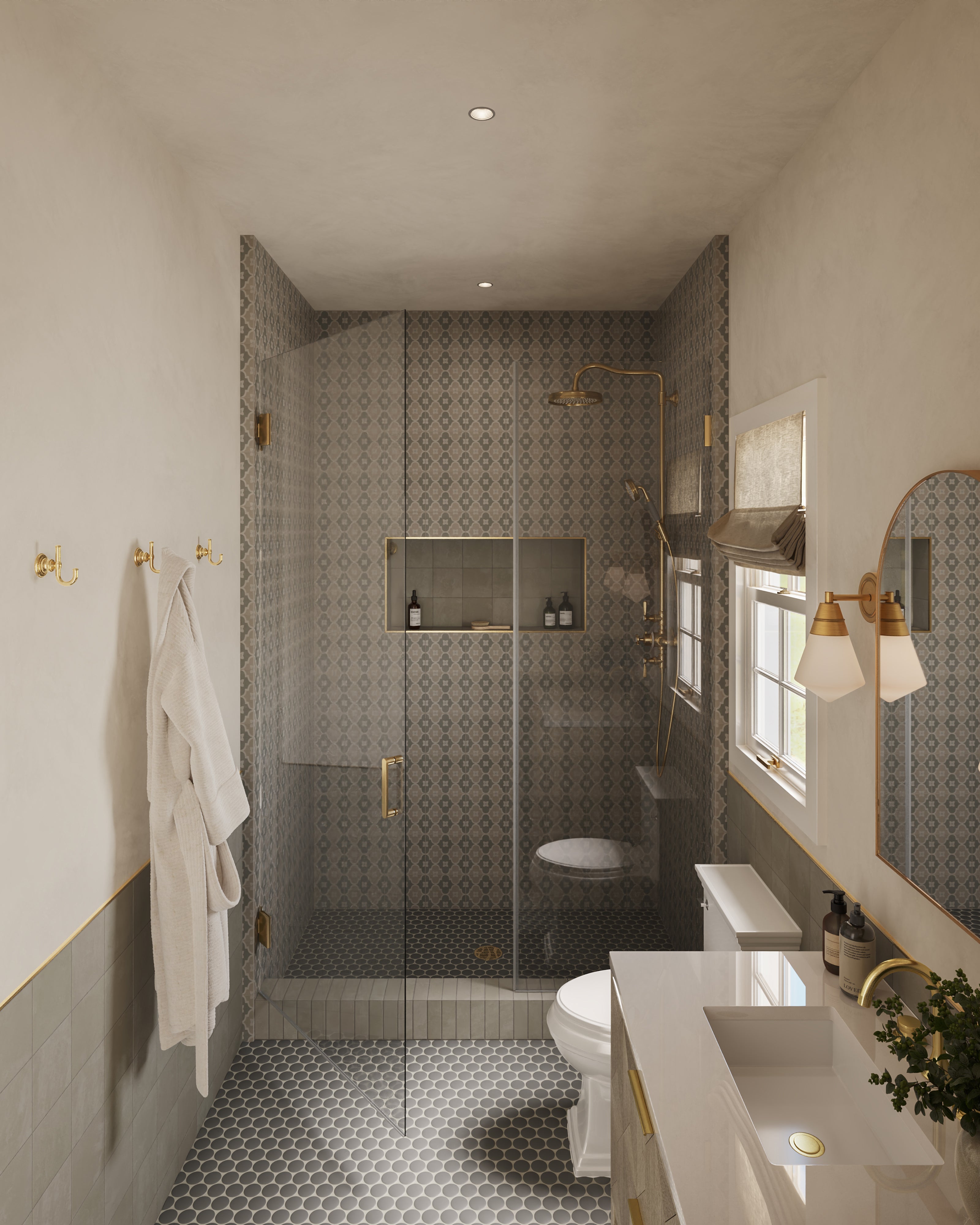 Brushed gold wall lights with geometric frosted glass shades framing an arched mirror beside a marble vanity in a patterned tile bathroom.