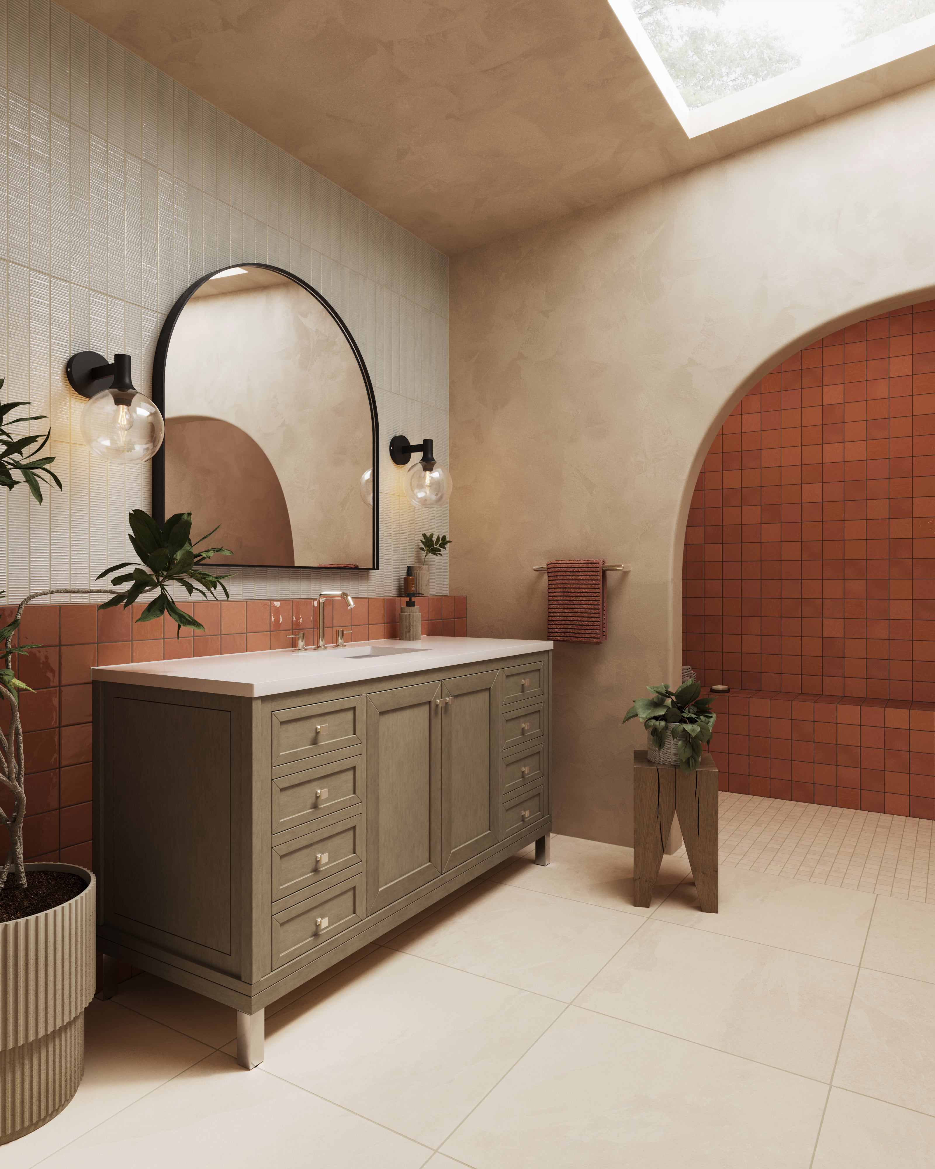 Modern bathroom with wood vanity, arched mirror, terracotta tile shower, and black globe wall sconces.