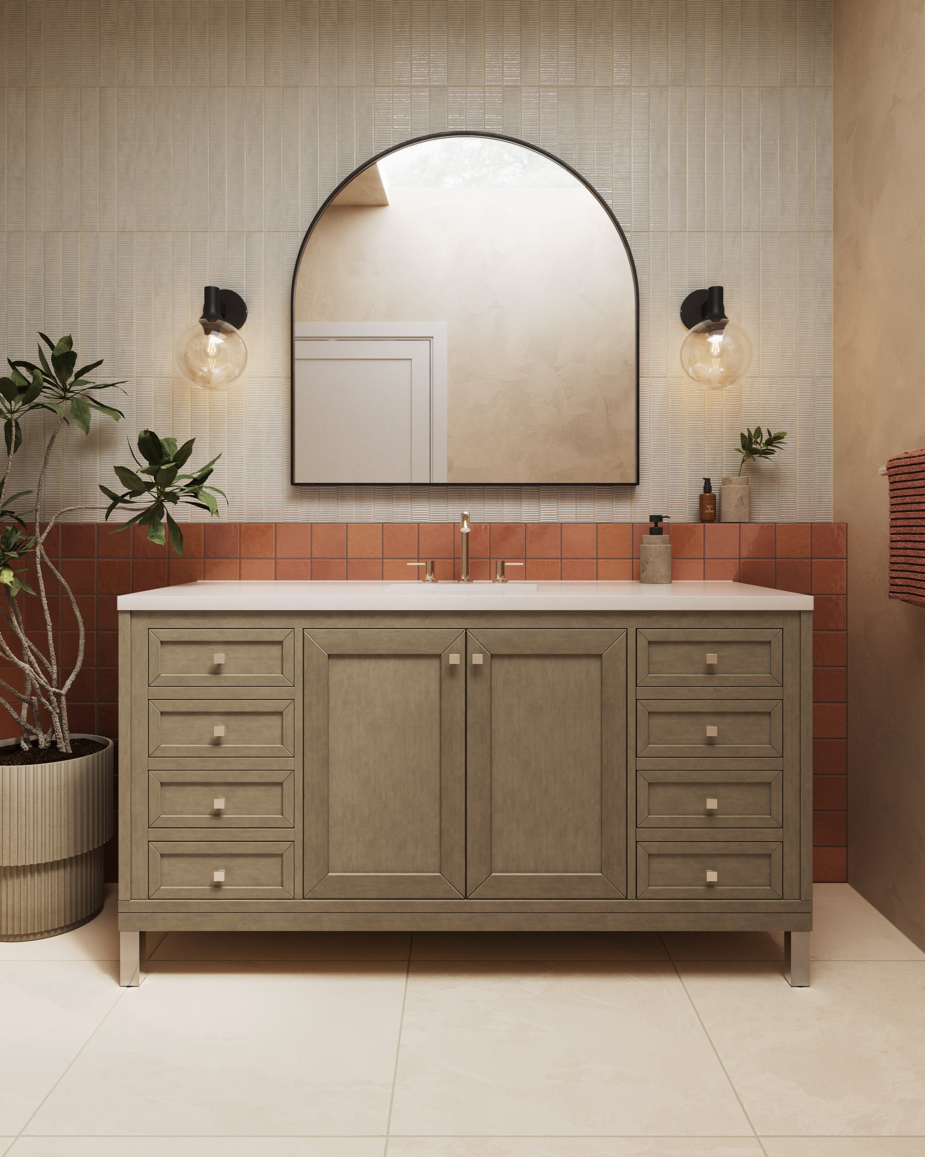 Modern bathroom vanity with wood cabinet, arched mirror, terracotta square tile backsplash, and black globe sconces.