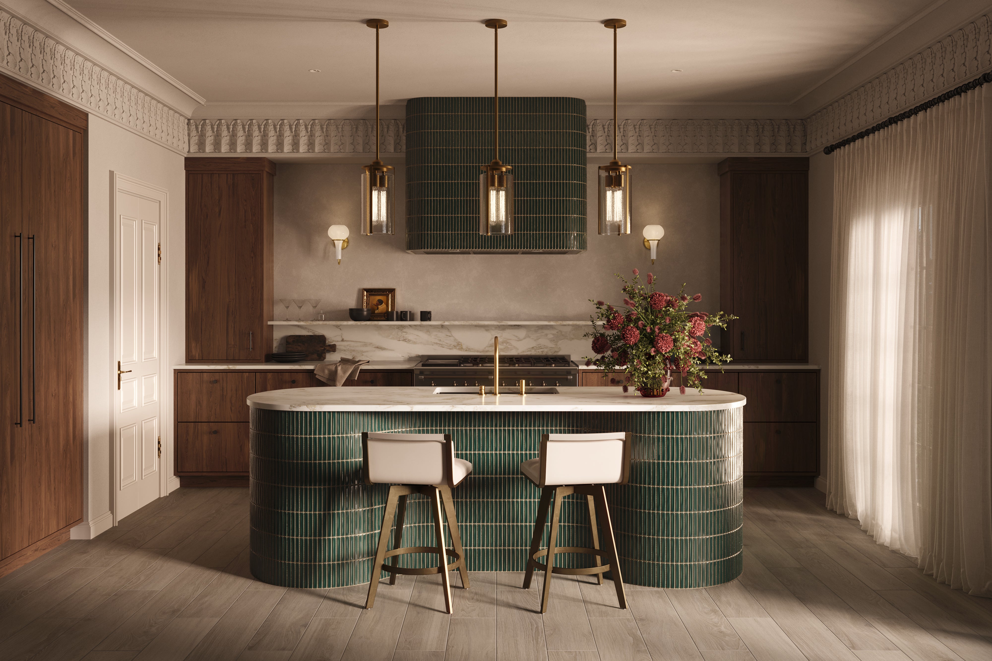 Warm modern kitchen with a large curved island wrapped in glossy dark green kitkat mosaic-look tile, paired with a white countertop, brass fixtures, two upholstered bar stools, pendant lights, wood cabinetry, and sheer curtains filtering natural light.