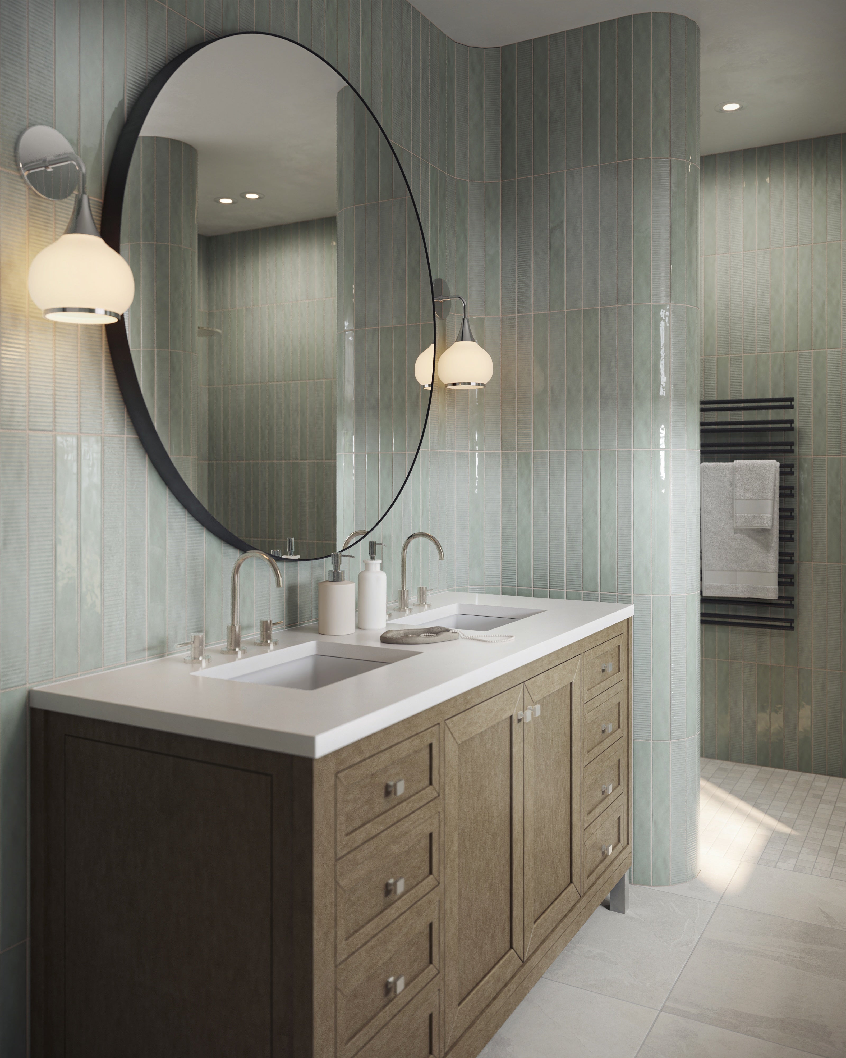 Set along pale green vertical tiles, the Janelle 60 inch double vanity in Walnut Whisper features warm wood cabinetry and a White Zeus Silestone countertop beneath a round mirror.