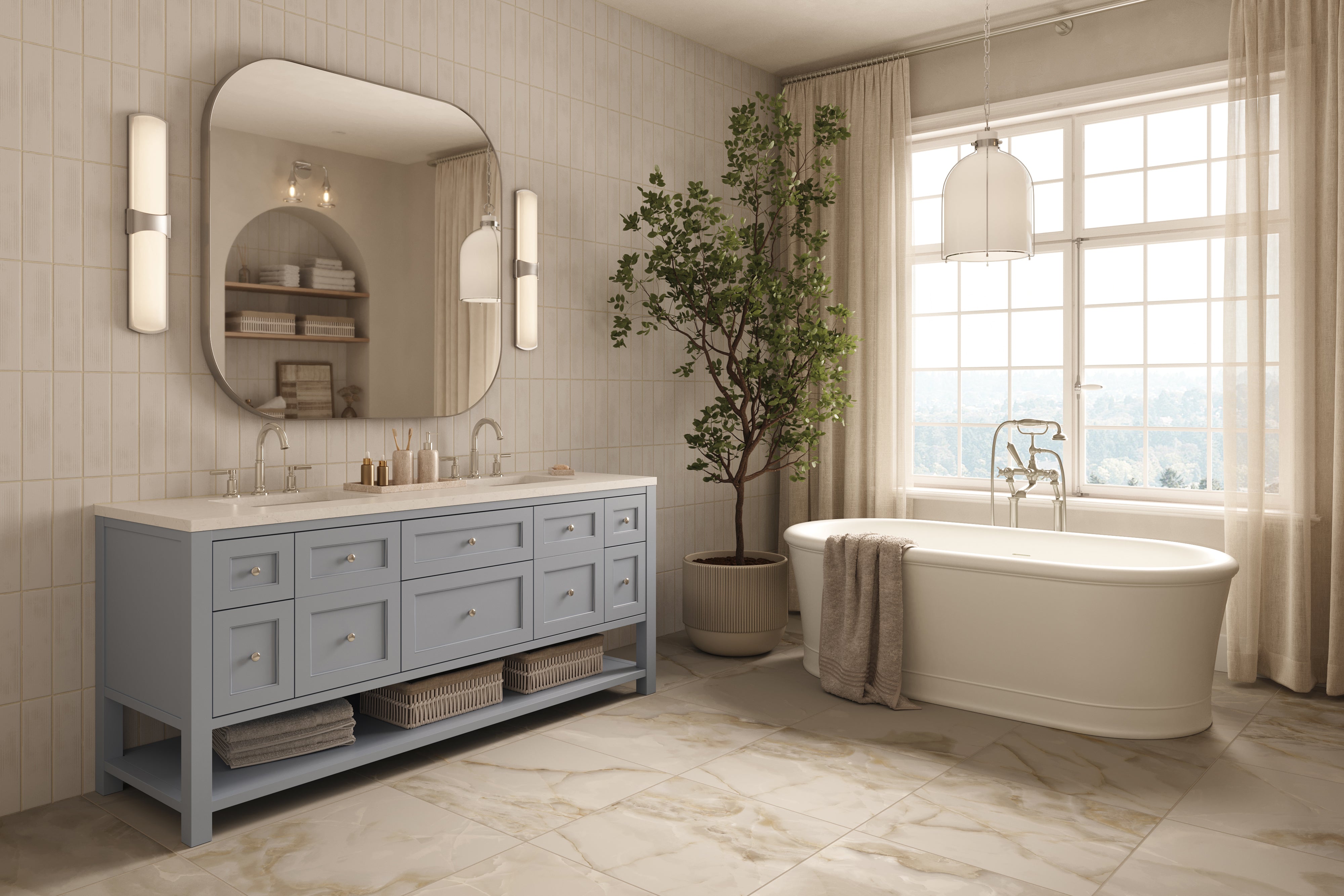 Elegant bathroom with blue vanity, freestanding tub, marble tile flooring, polished nickel dome pendant light, and soft natural light.