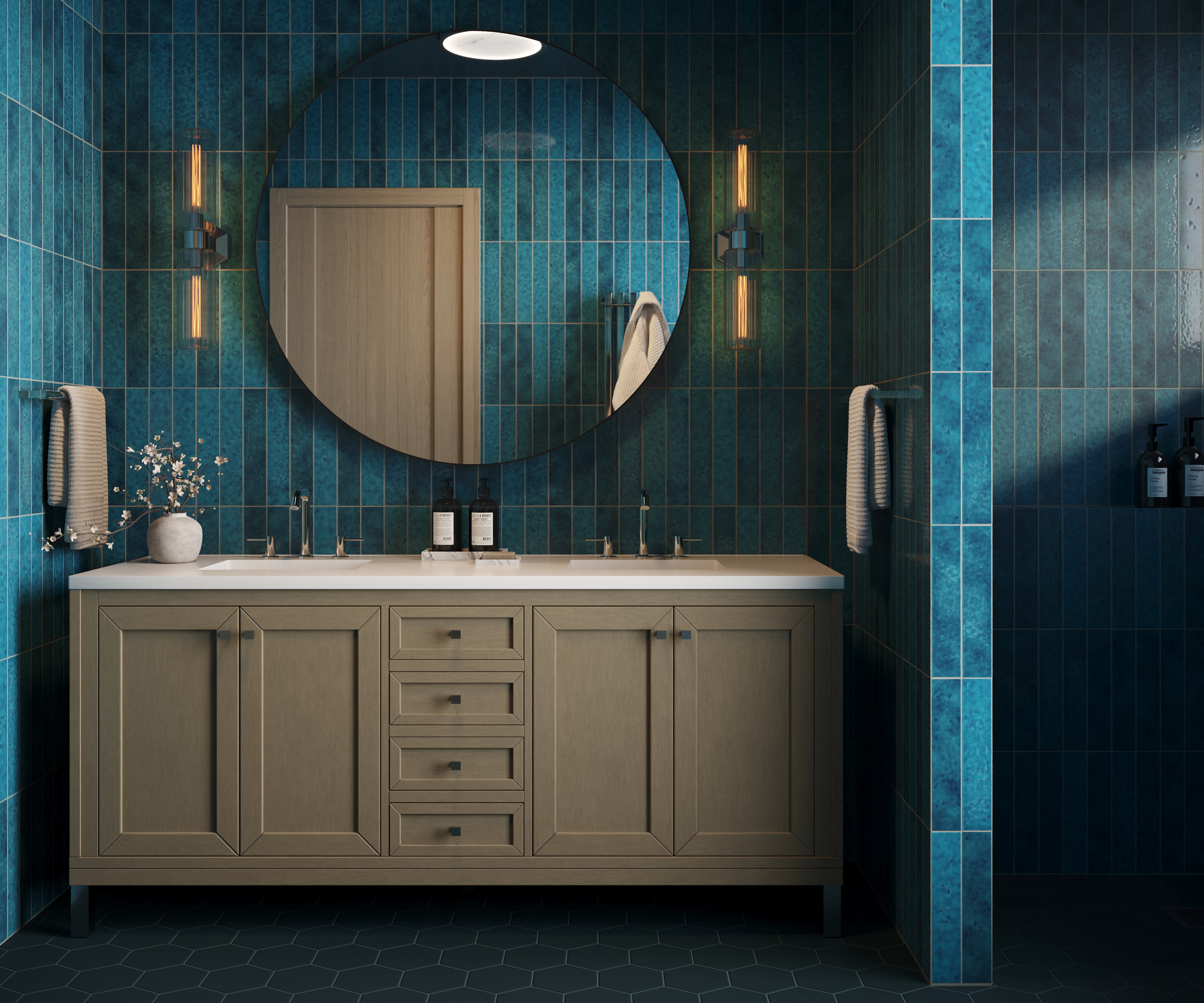 A continuous installation of blue 2x13 ceramic wall tiles brings depth and dimension to the bathroom, pairing handcrafted variation, elongated proportions, and a richly glazed surface for a seamless look.