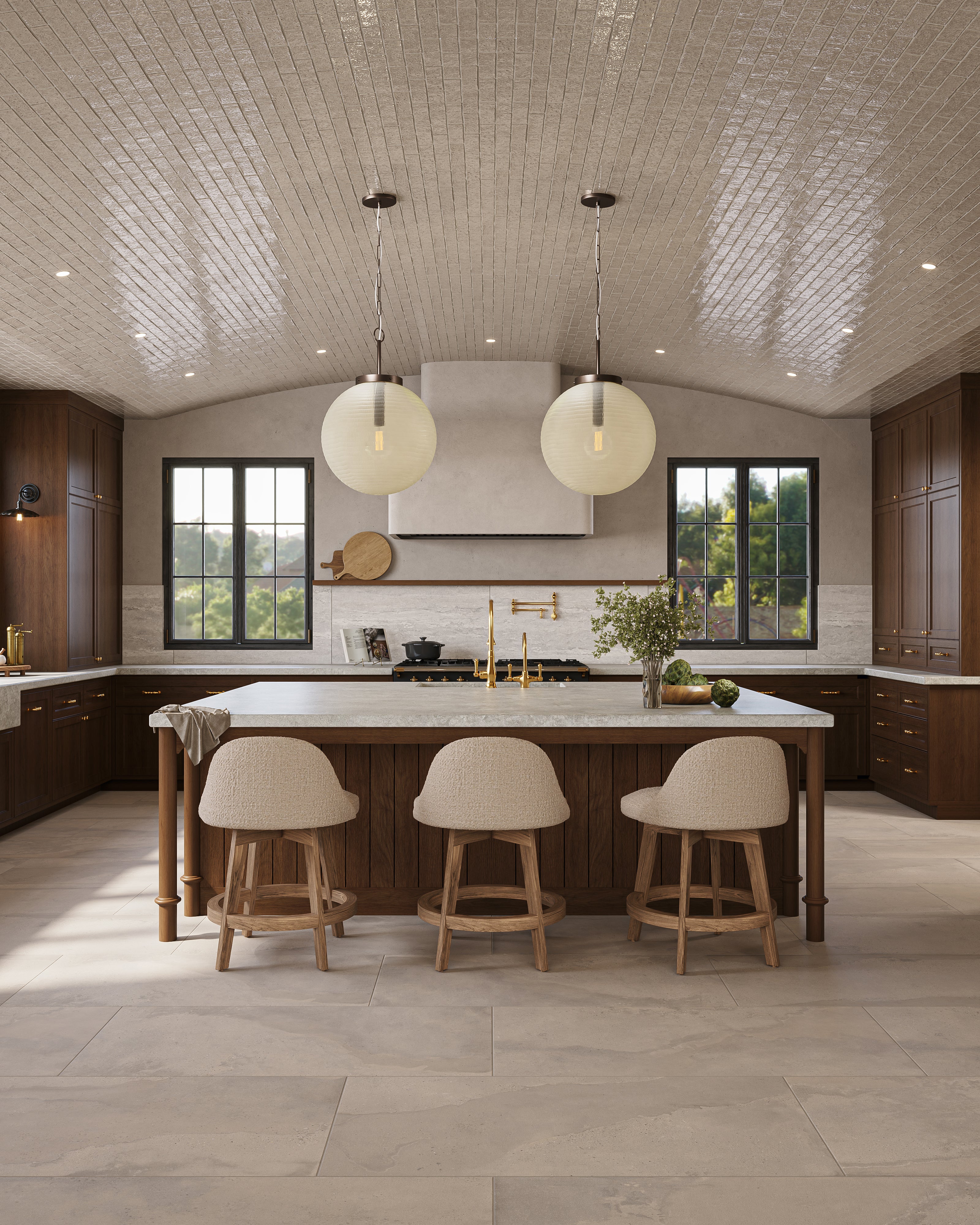 Spacious kitchen with taupe large-format floor tile, a wood island with upholstered stools, dark wood cabinetry, brass fixtures, globe pendant lights, black-framed windows, and a glossy tiled barrel ceiling reflecting natural light.