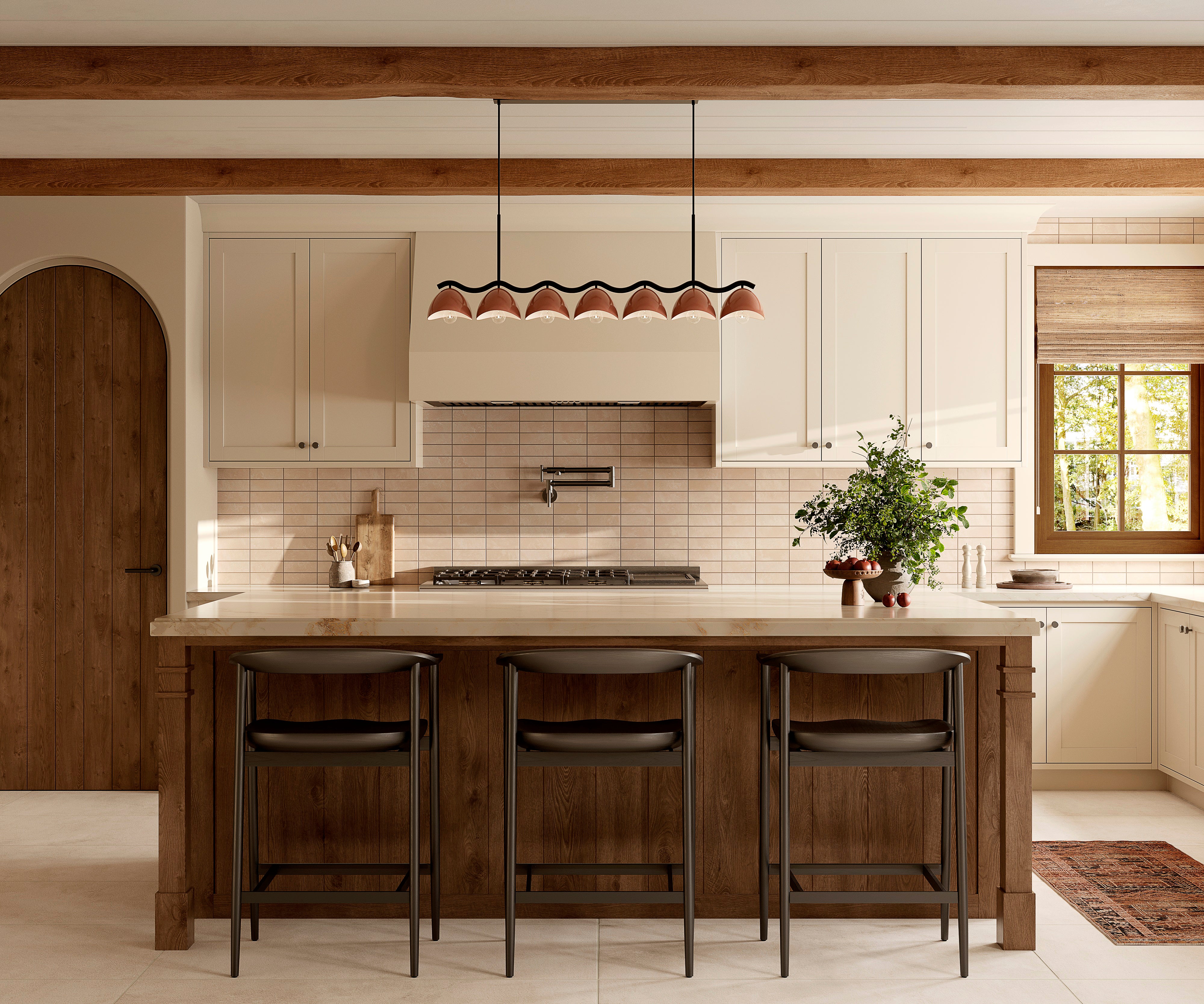 Warm kitchen with beige subway tile backsplash, wood island seating with bar stools, and seven purplish, dark red dome linear pendant beneath exposed beams.