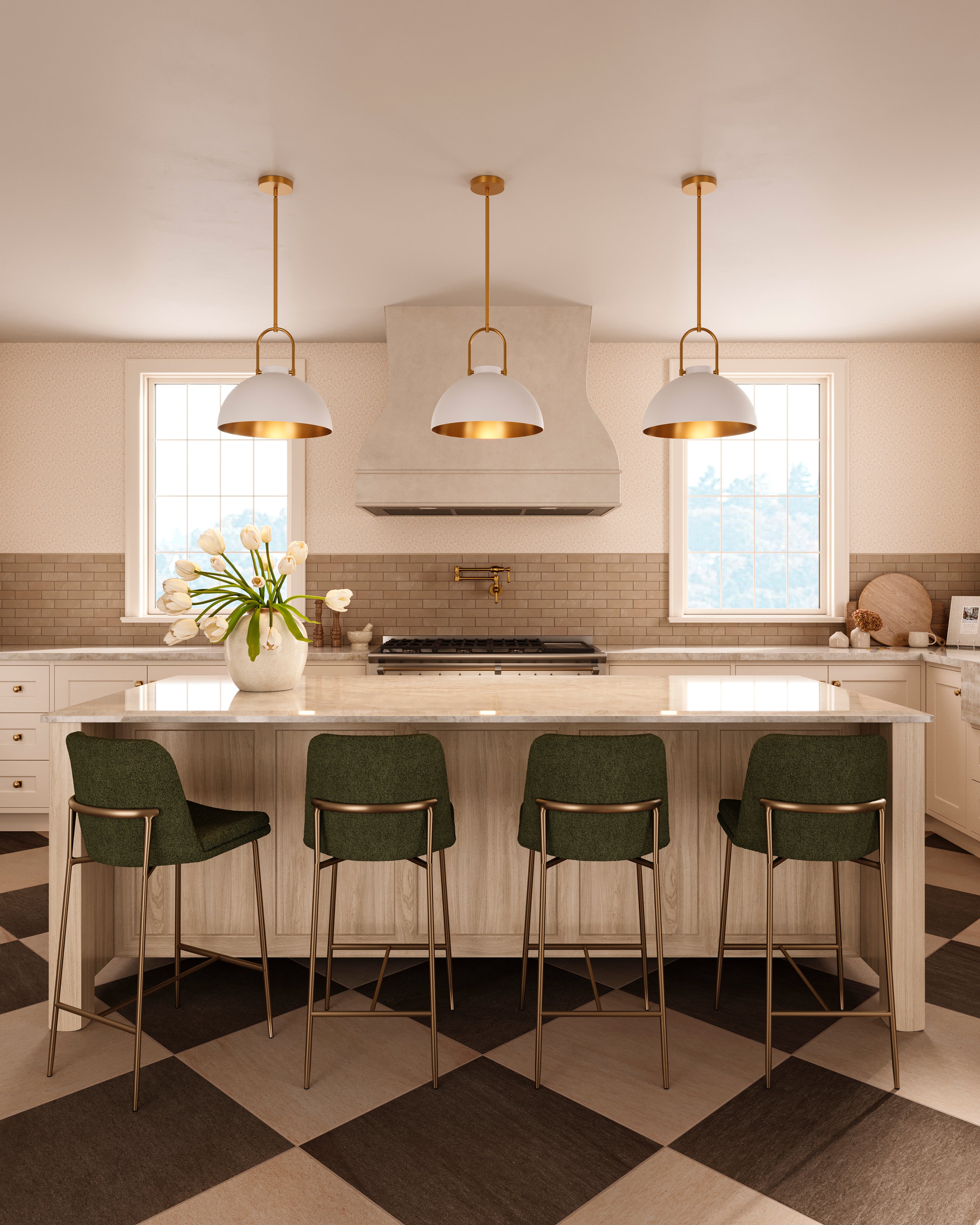 Three white dome pendant lights with gold interiors and brushed gold suspension above a kitchen island with green bar stools.