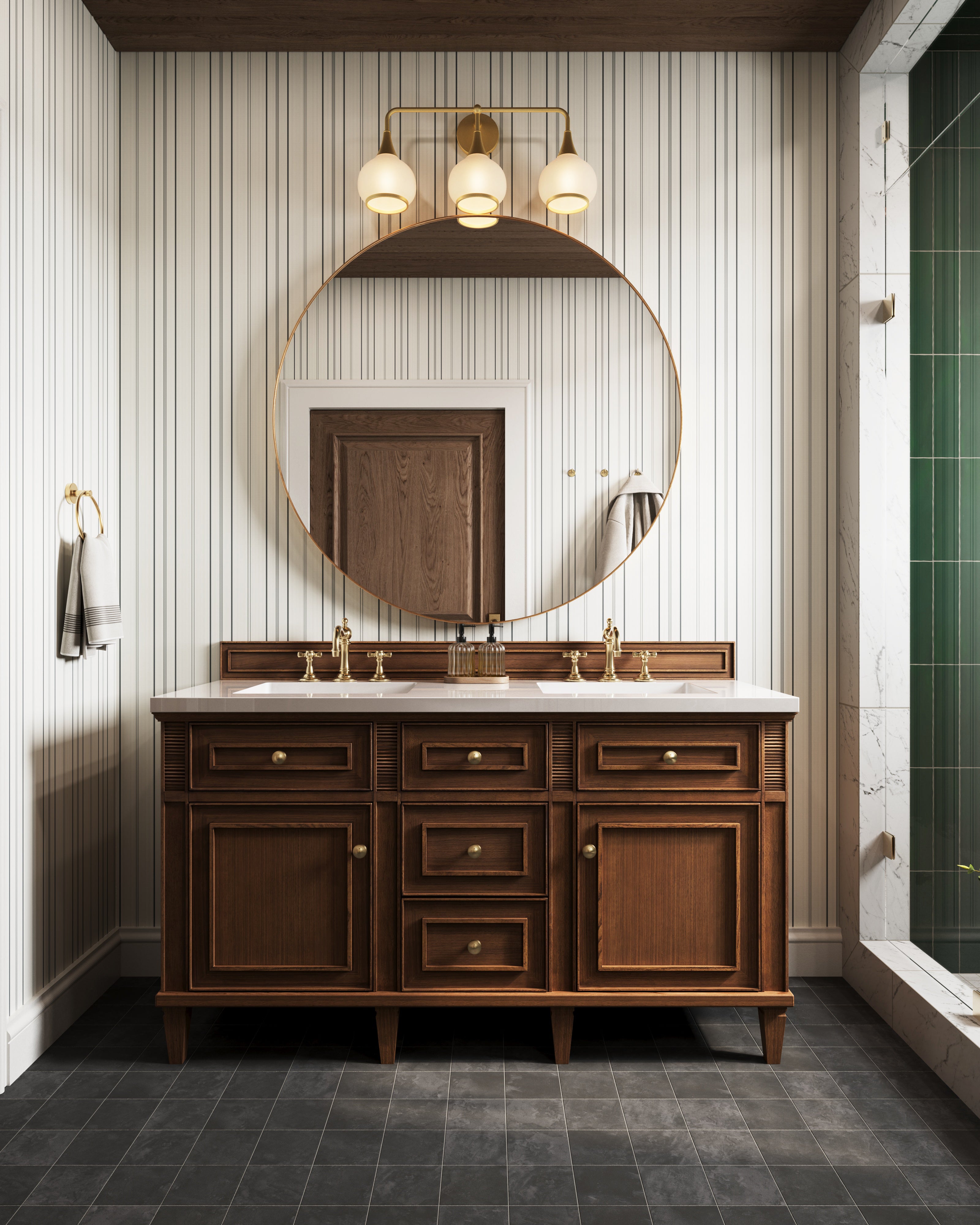 Bathroom vanity with wooden cabinet, round mirror, aged gold three-light fixture with opal glass shades, and striped wall paneling.