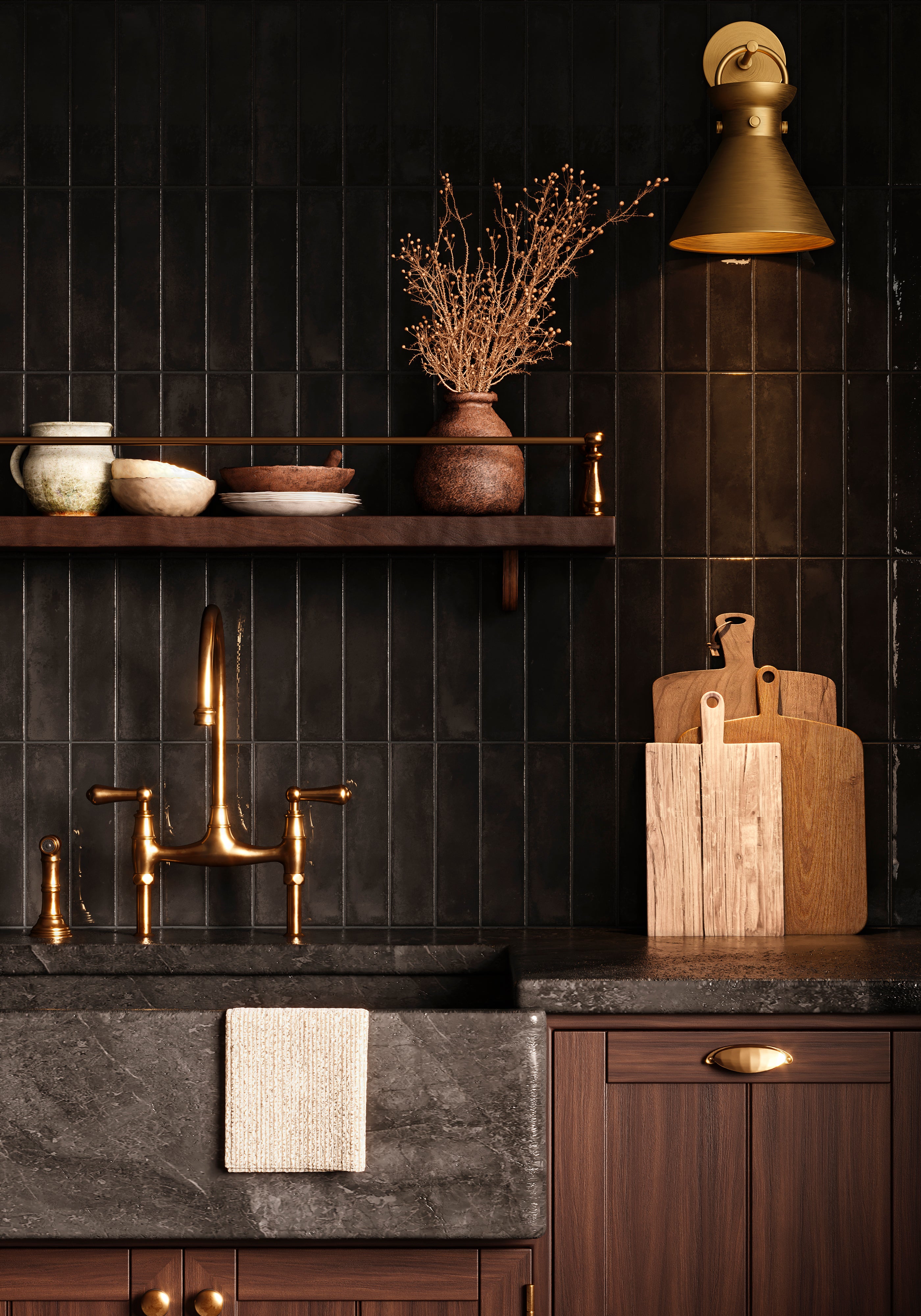 Aged gold wall sconce with conical shade illuminating a kitchen sink area with dark tiled backsplash, wooden shelves, and cutting boards.
